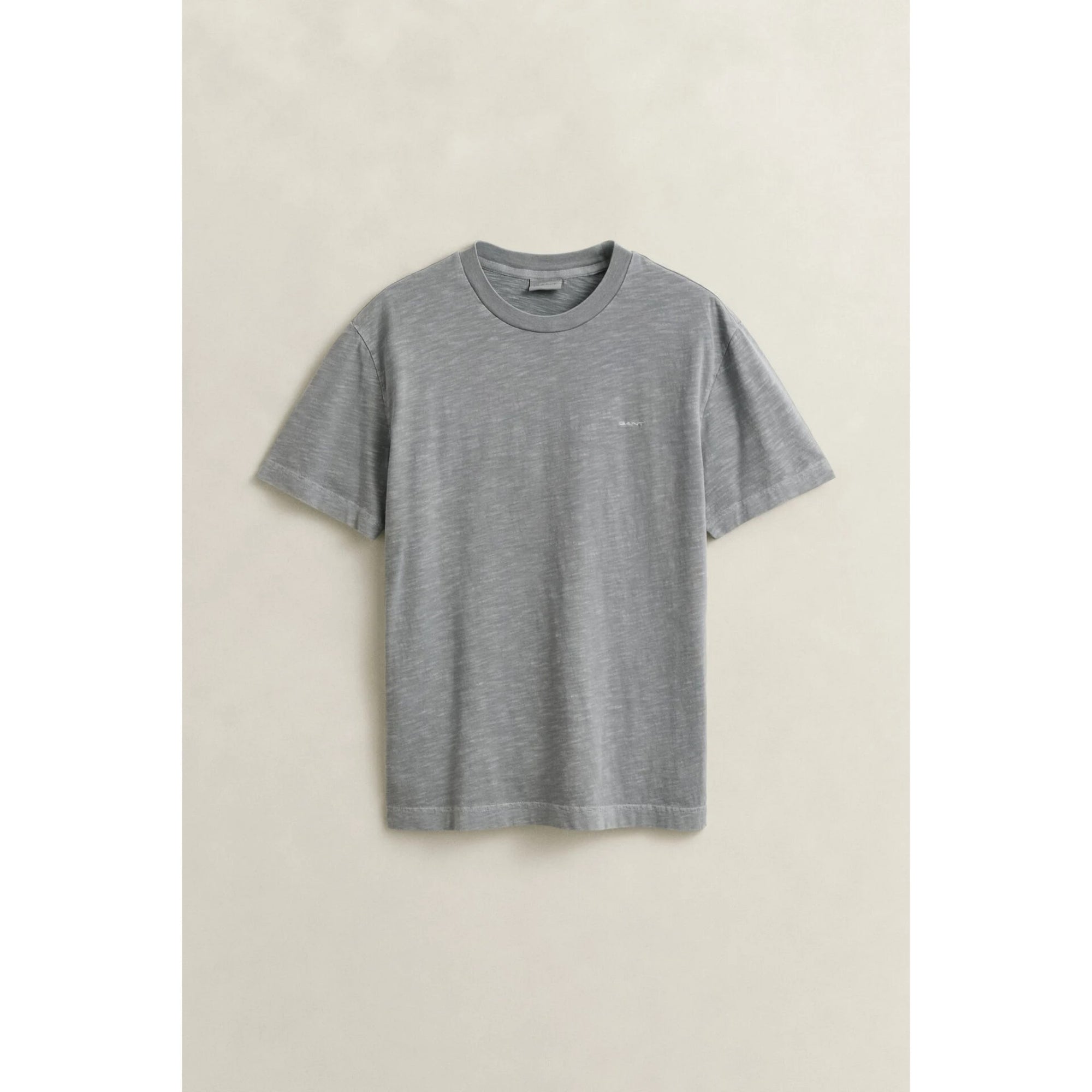 Gray t-shirt on a beige background