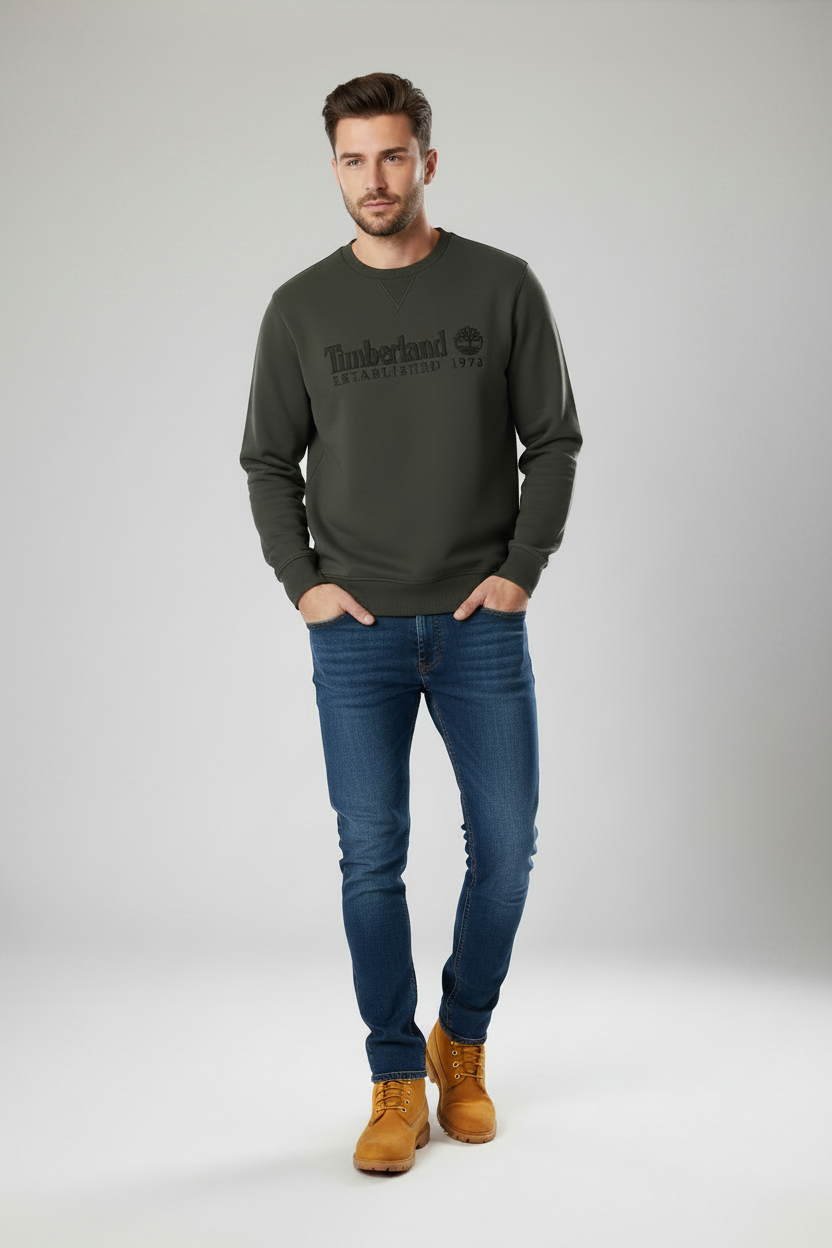 A dark gray Timberland pullover Crew Jumper with a tonal black embroidered logo on the chest,wearing with Timberland Premium Classic 6" Waterproof Boots