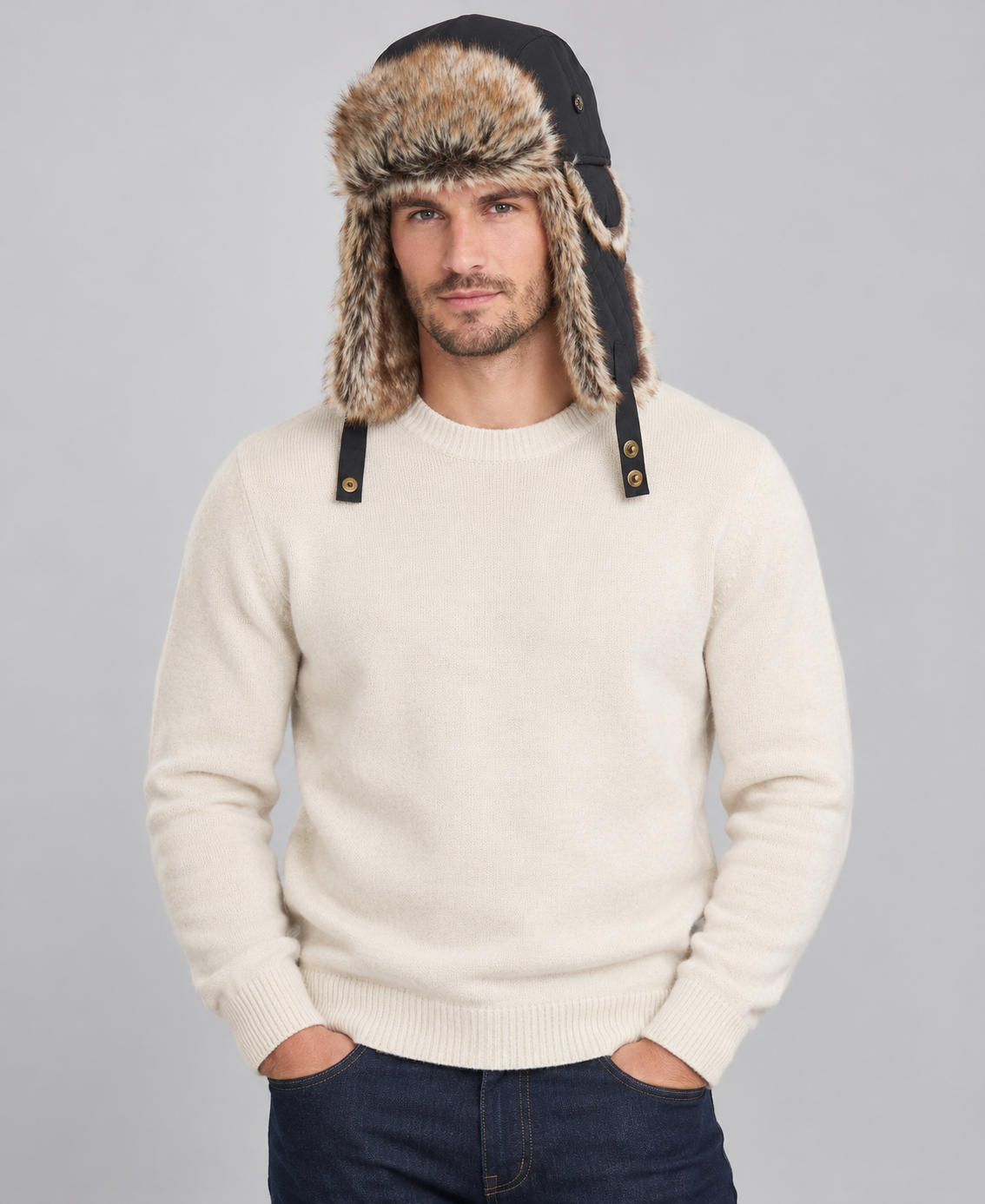 A man wearing a Barbour Cleadon Trapper Hat in Classic Black with faux fur.
