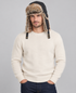 A man wearing a Barbour Cleadon Trapper Hat in Classic Black with faux fur.