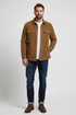 A brown corduroy button-up shirt jacket with two chest flap pockets, displayed on a white background.