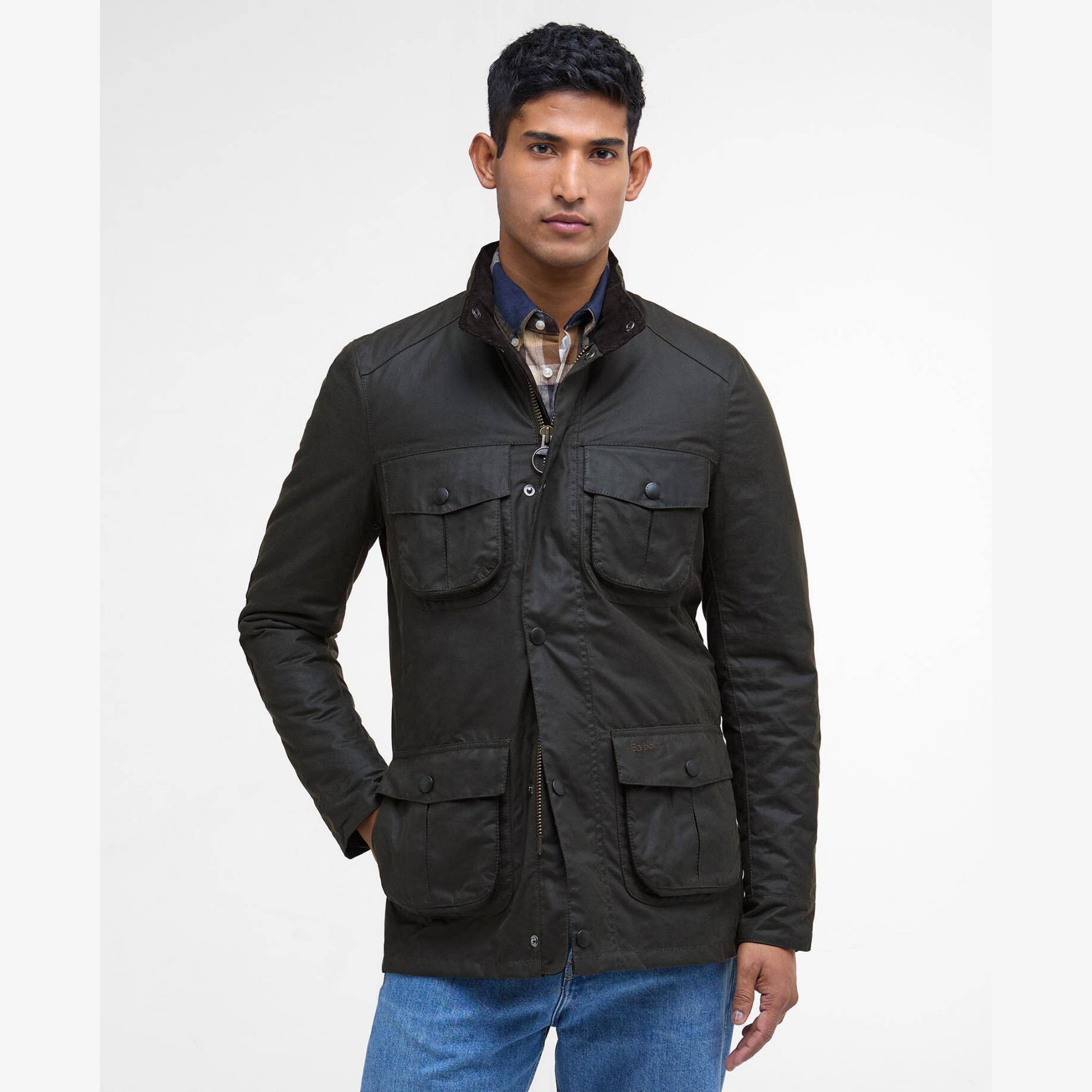 Man wearing a olive Barbour Corbridge jacket with multiple pockets