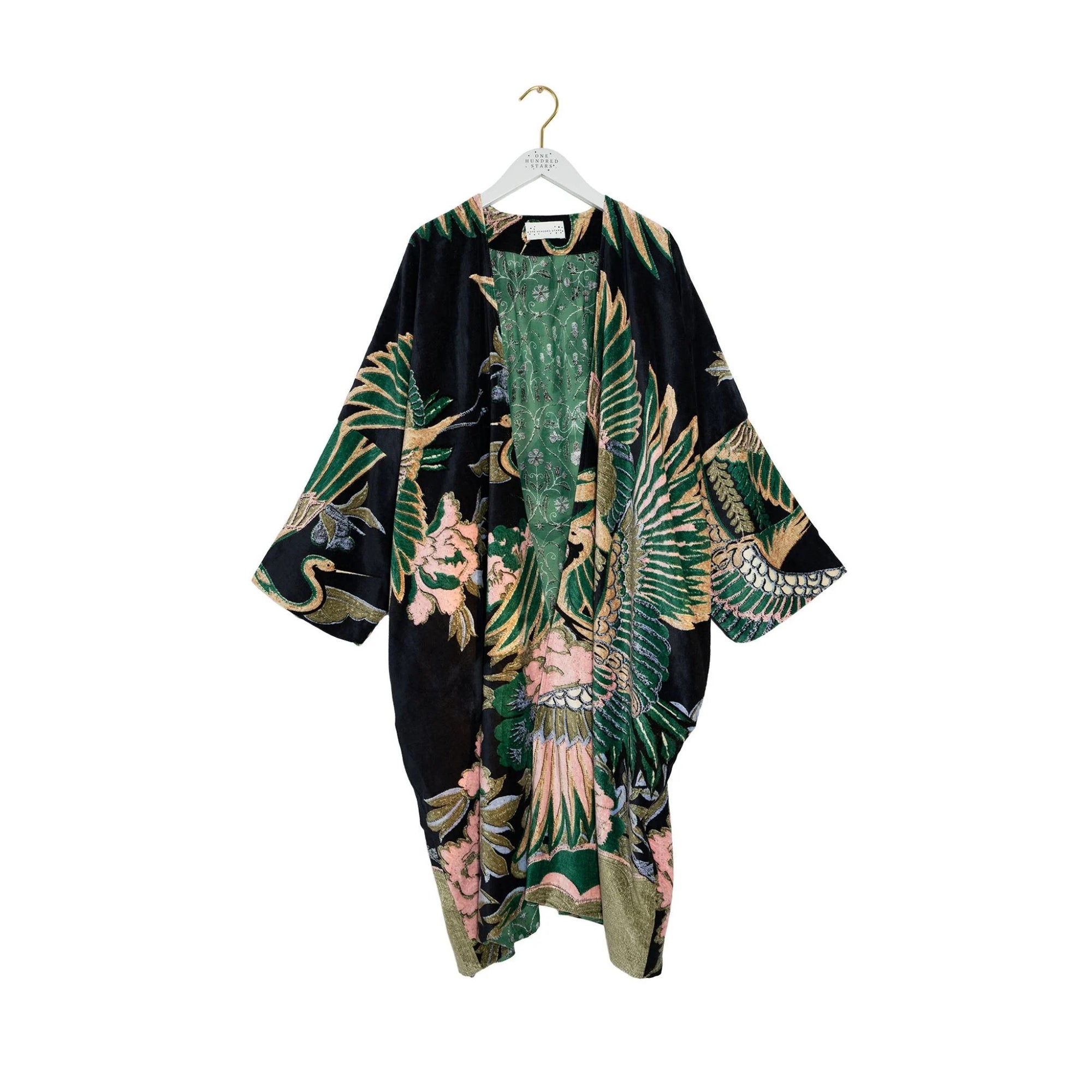 Floral kimono on a hanger against a white background