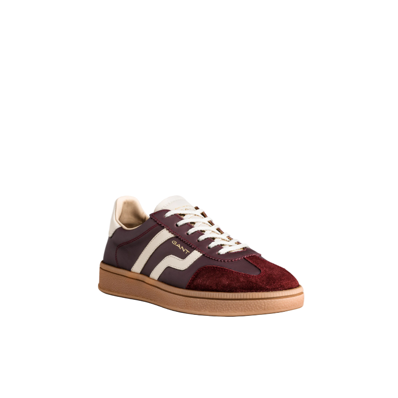 Maroon sneaker with white accents on a light gray background