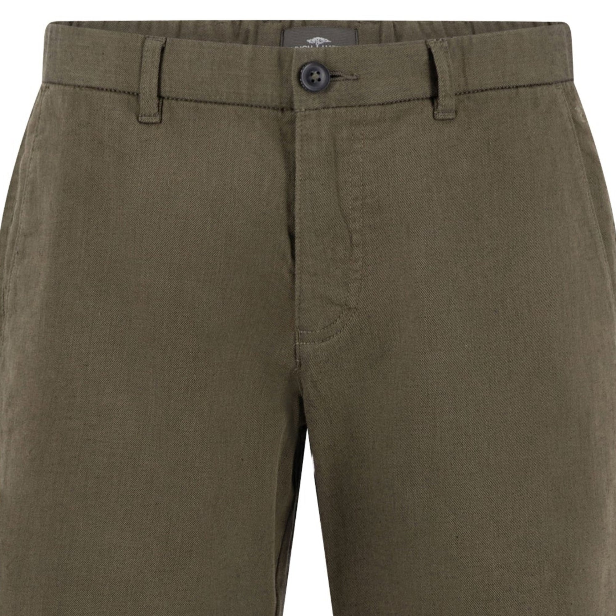 Close-up of Khaki pants with a Fynch-Hatton brand label 
