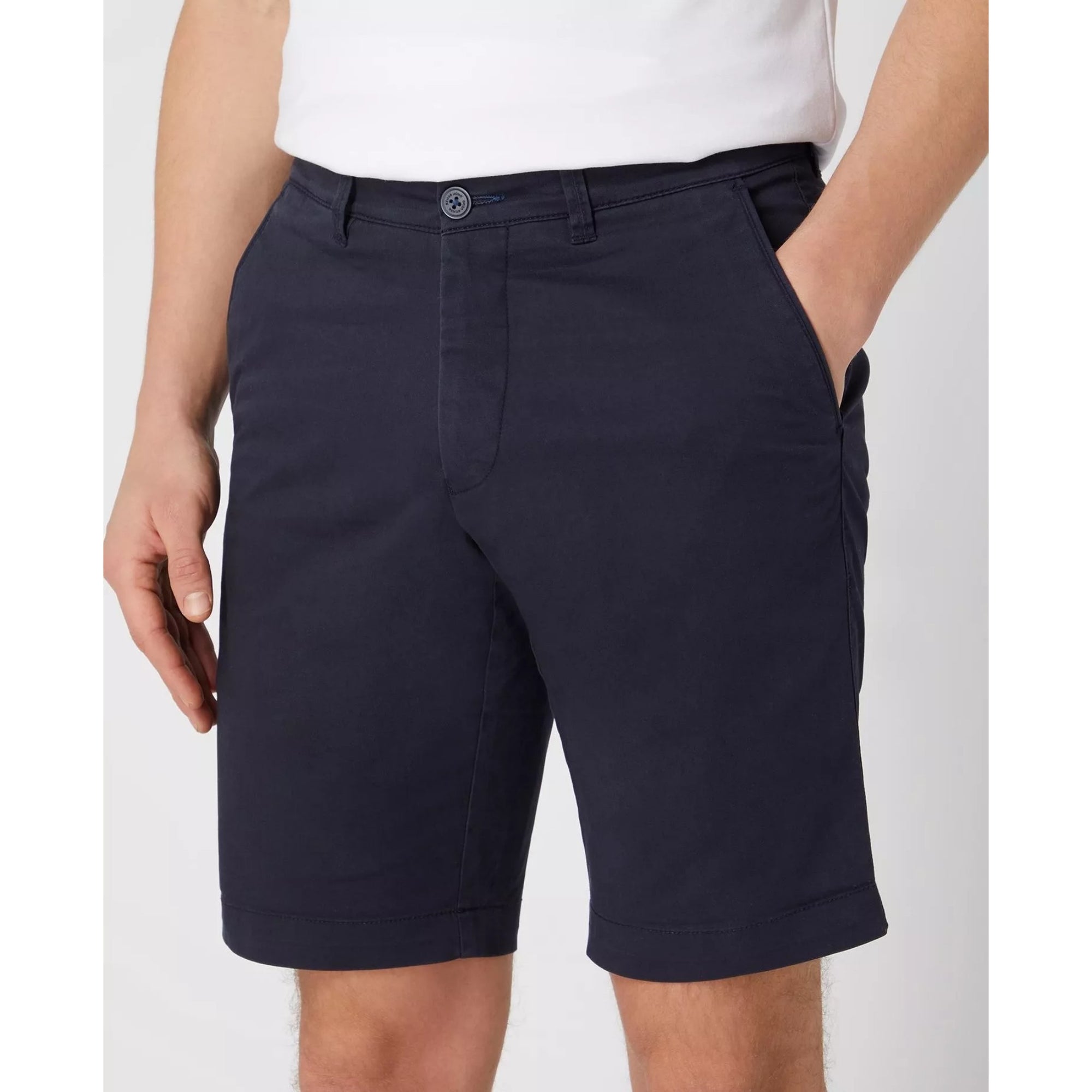 Navy shorts worn by a person on a white background