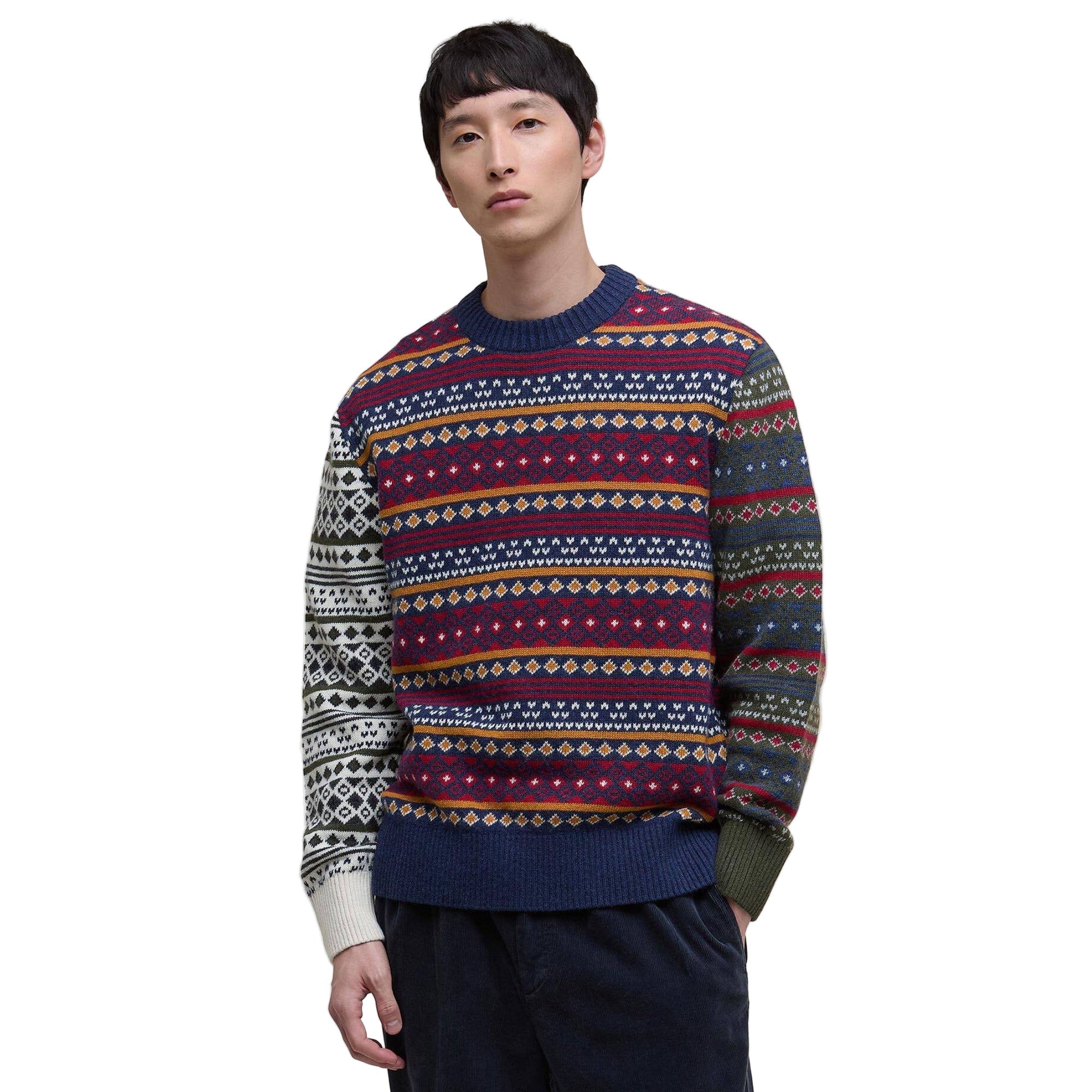 Person wearing a Barbour patterned sweater on a white background