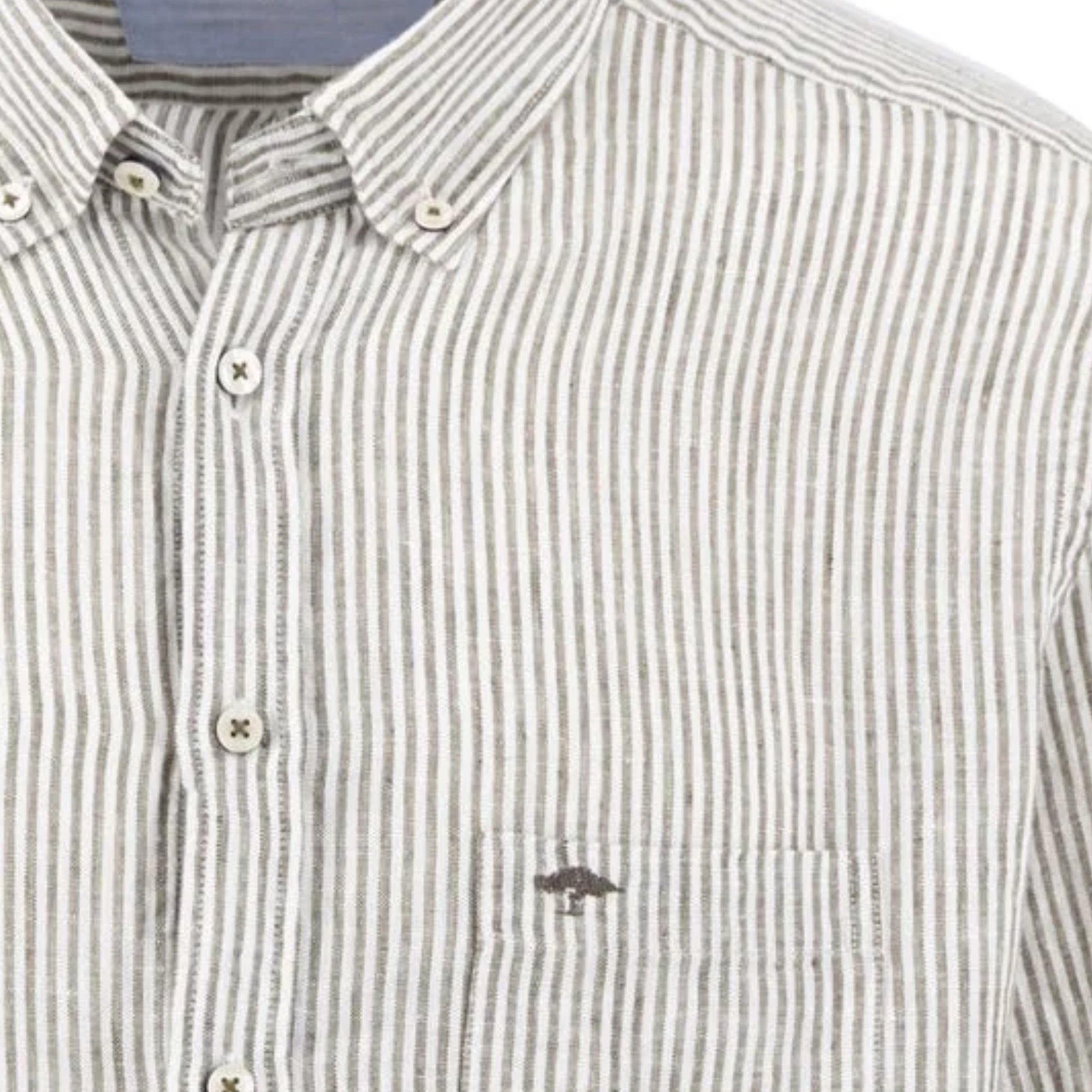 Close-up of a striped shirt with a small logo on a white background