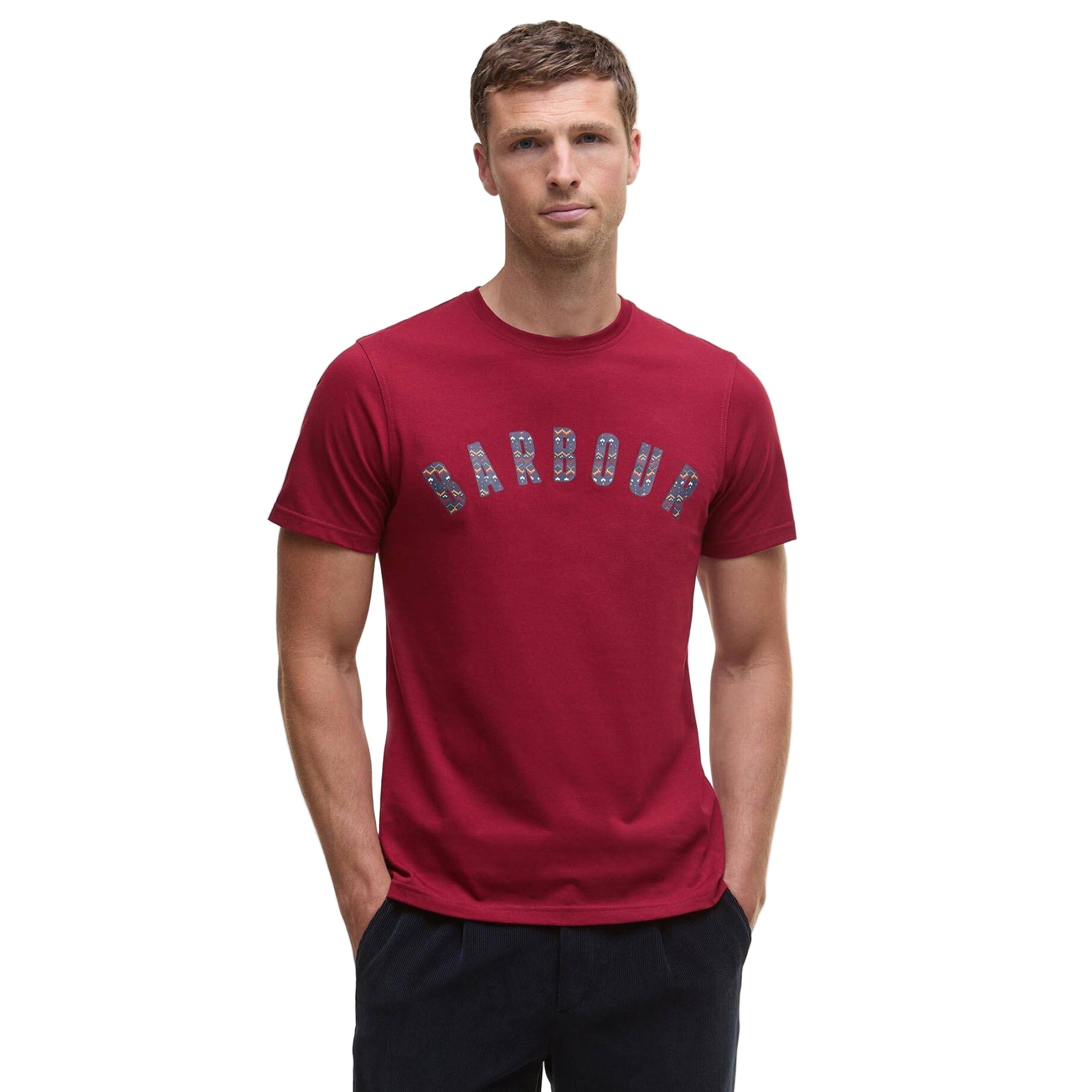Man wearing a red t-shirt with &#39;Barbour&#39; logo on a white background