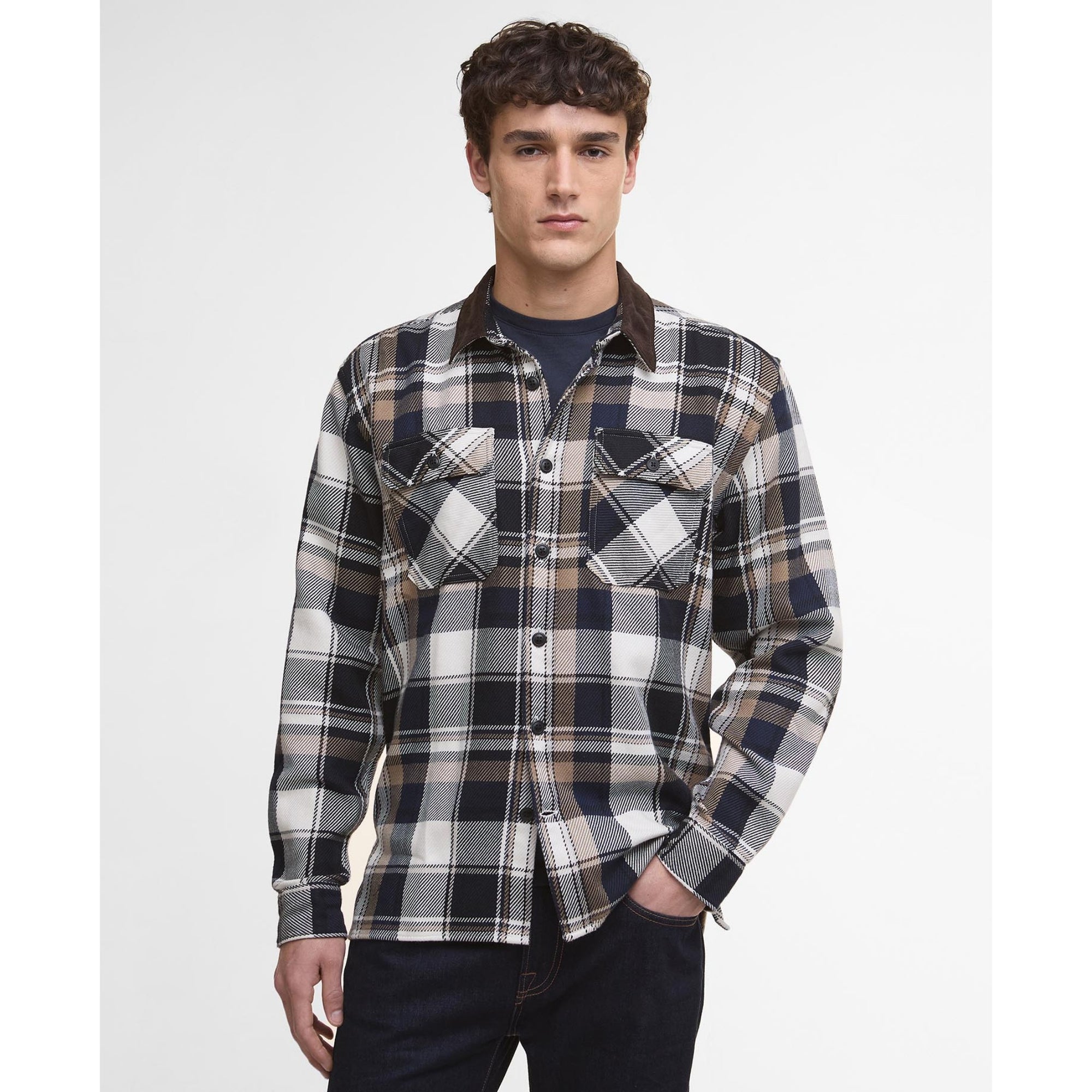 Man wearing a Barbour plaid shirt with a white background