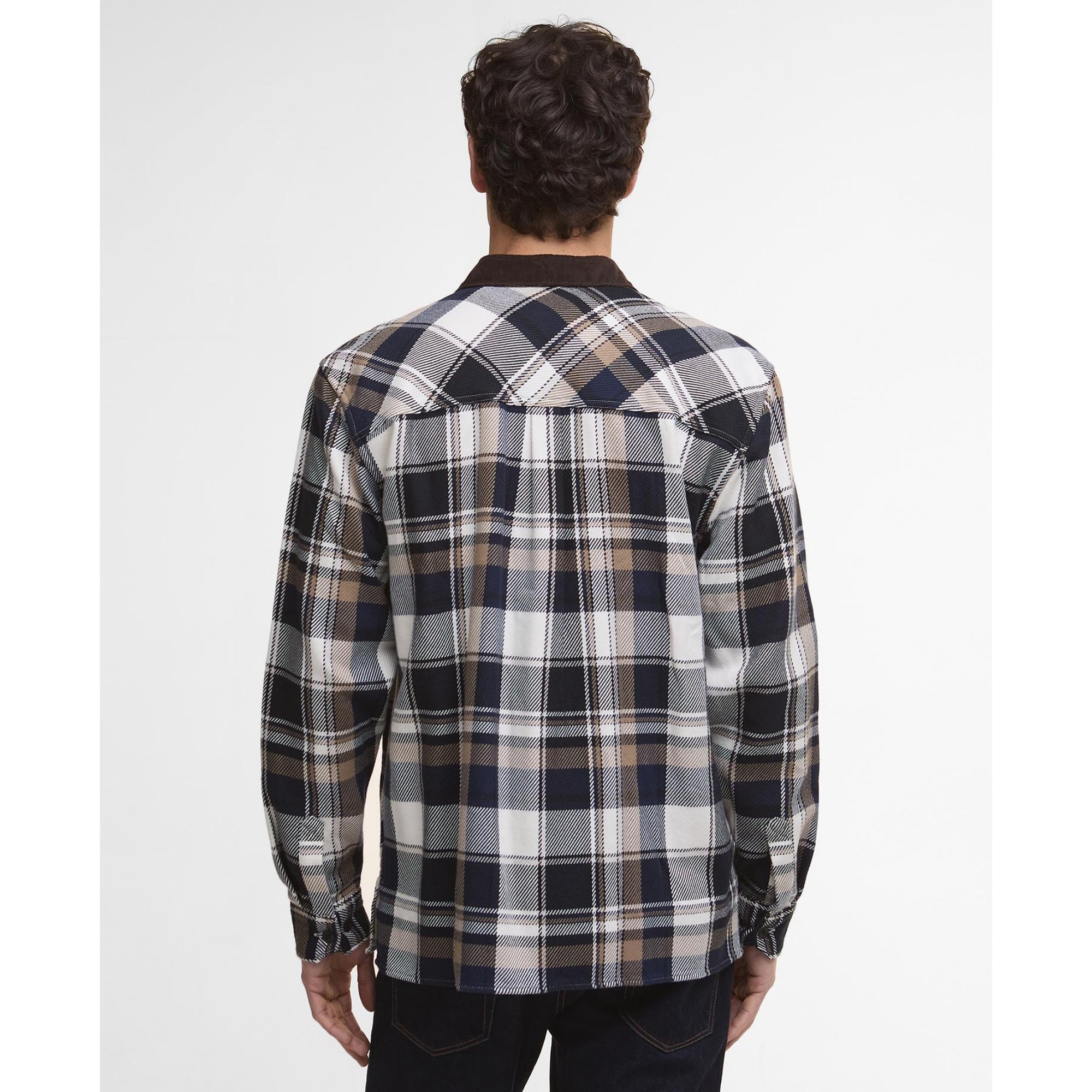 Man wearing a Barbour plaid shirt with a white background