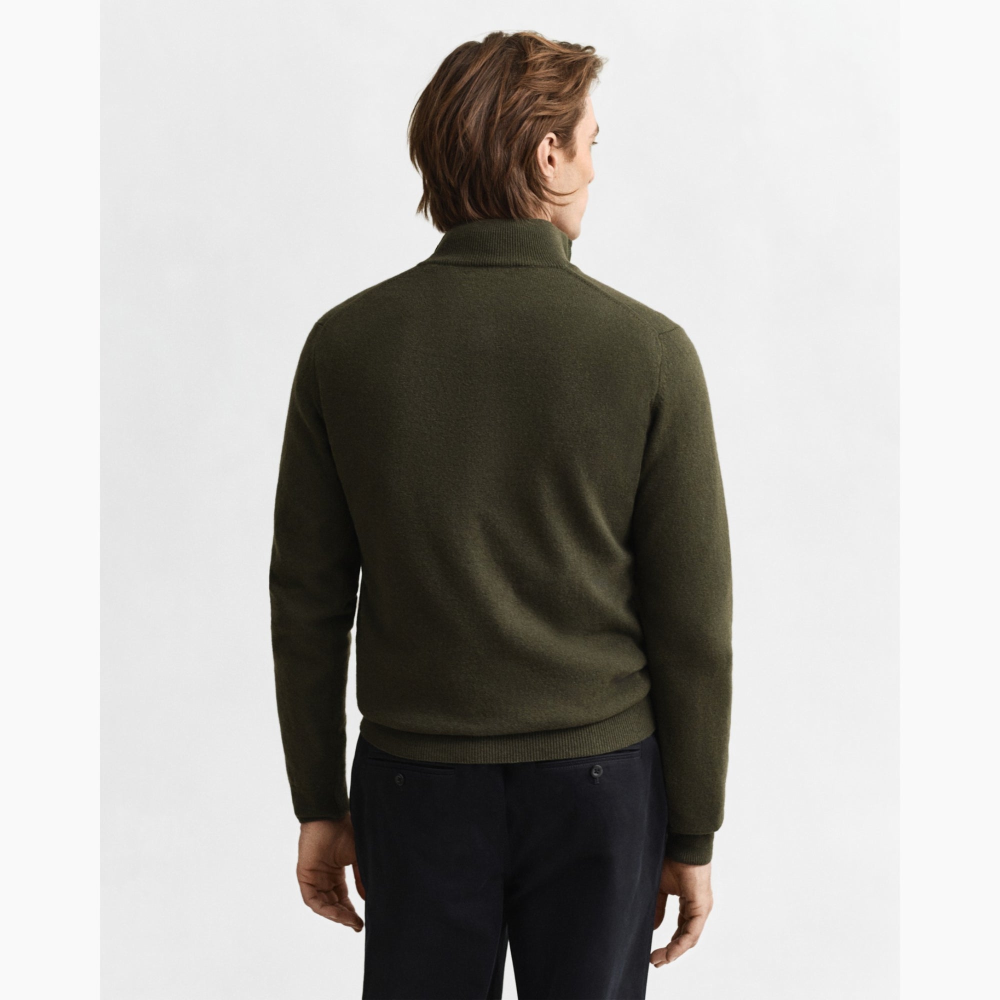 Man wearing a green half-zip GANT sweater