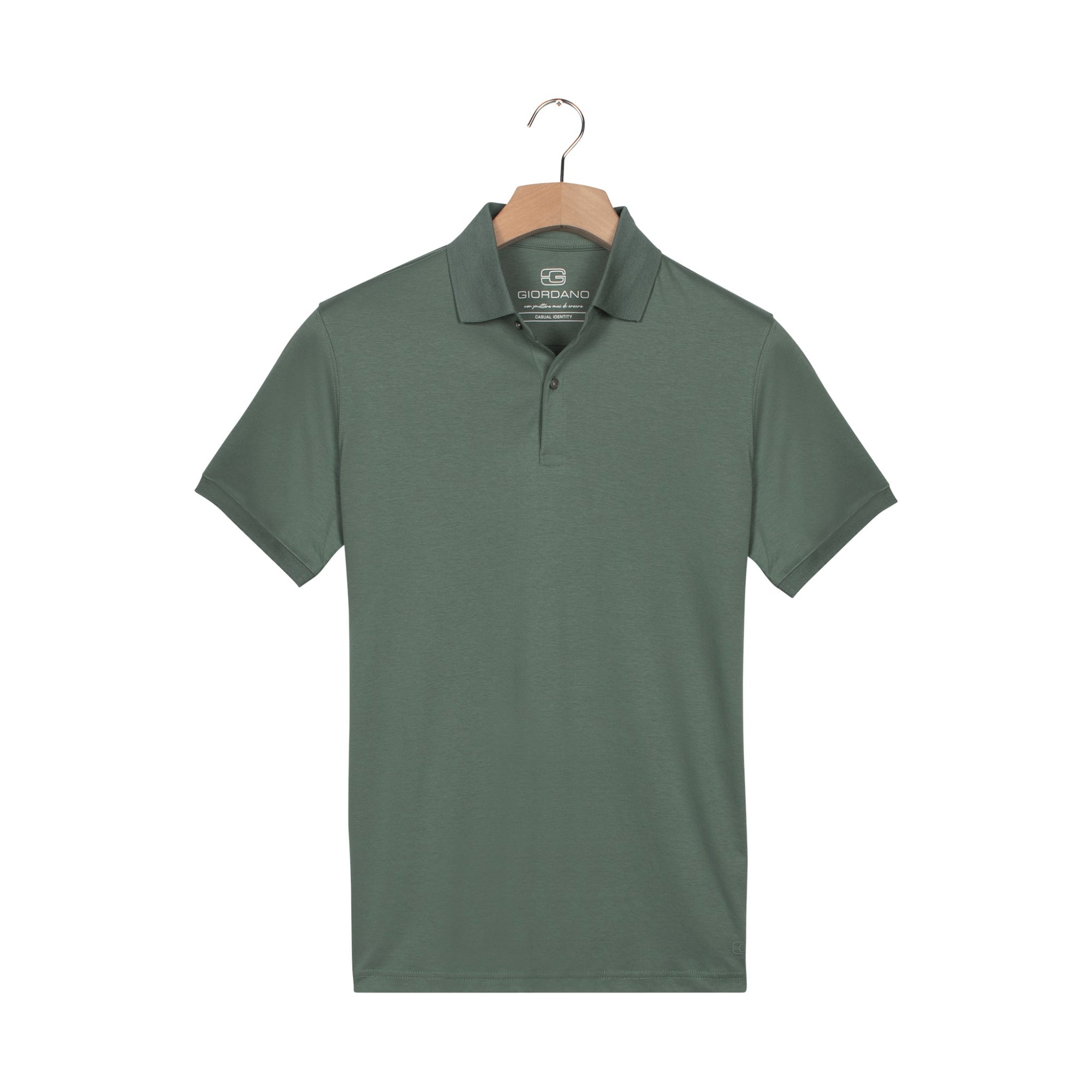 Green polo shirt on a hanger with a white background