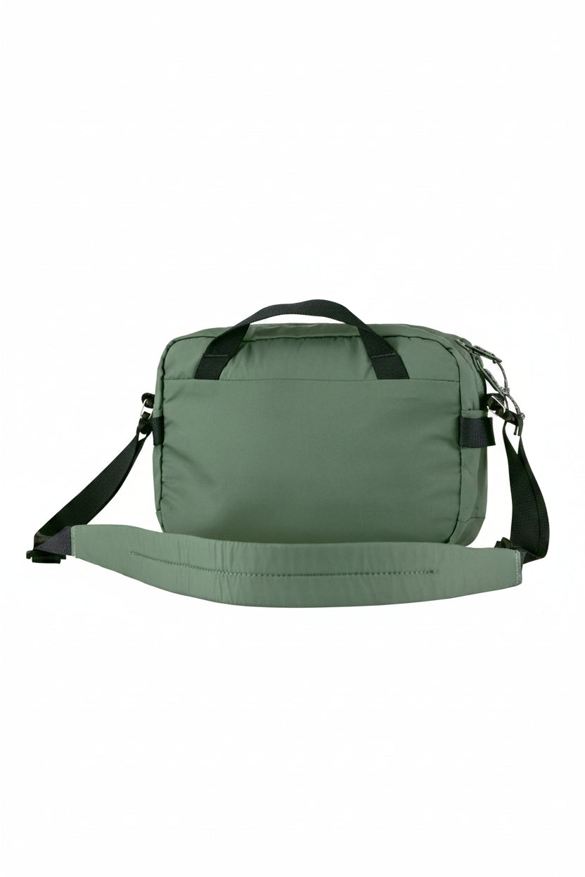 Green bag with a strap on a white background