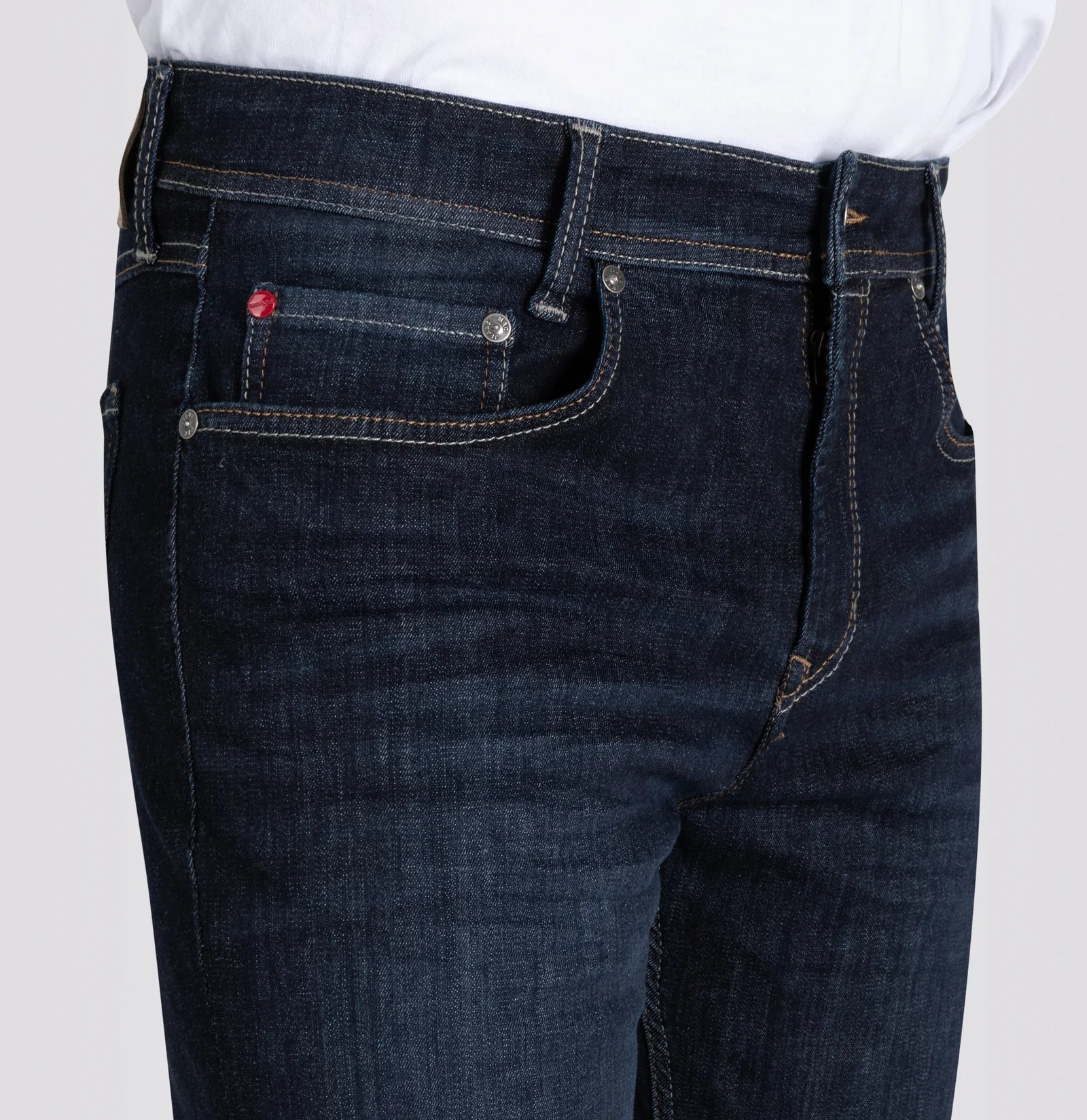 Dark blue jeans with a red label on a white background