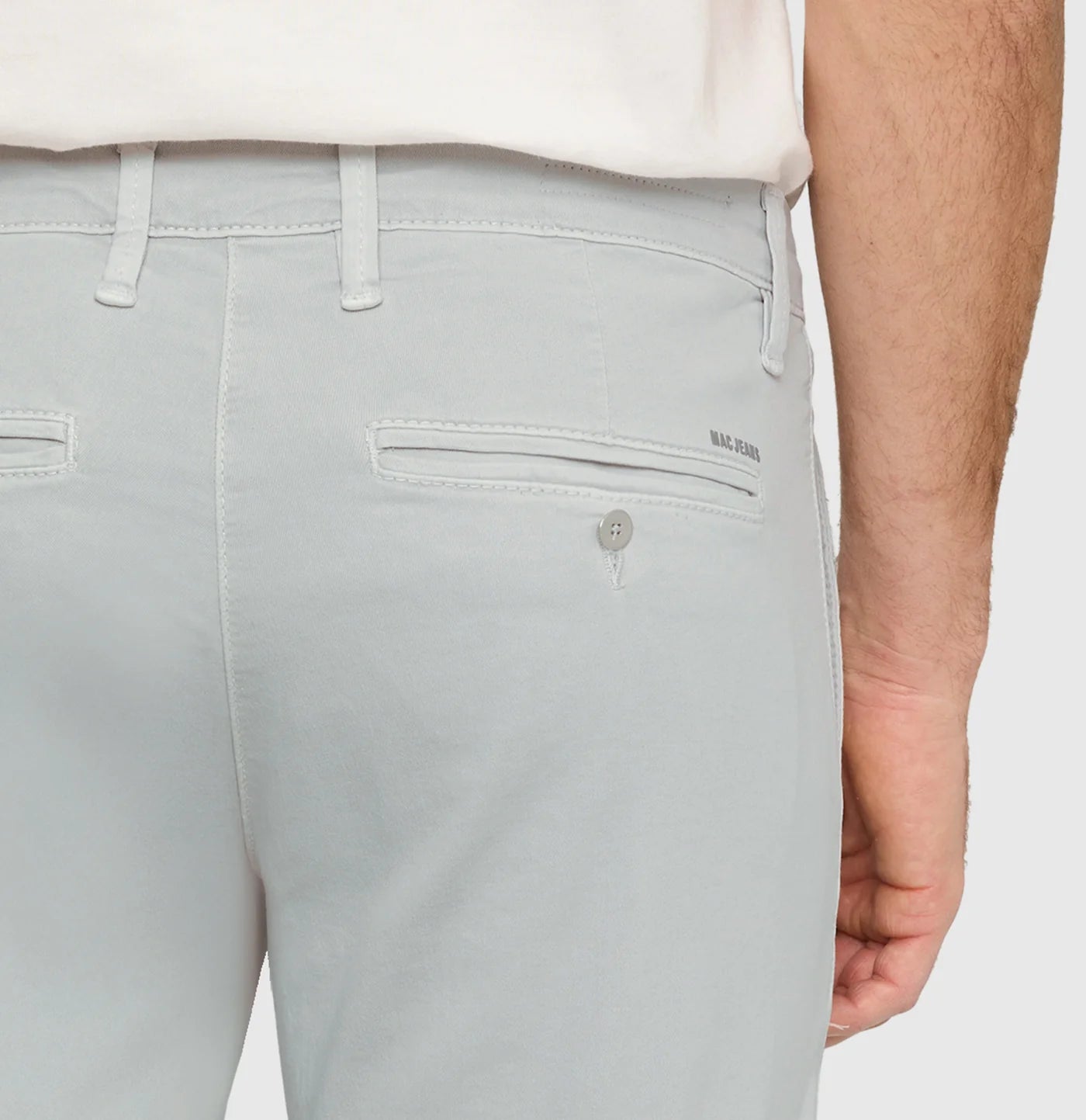 Light gray pants with a brand logo on a white background