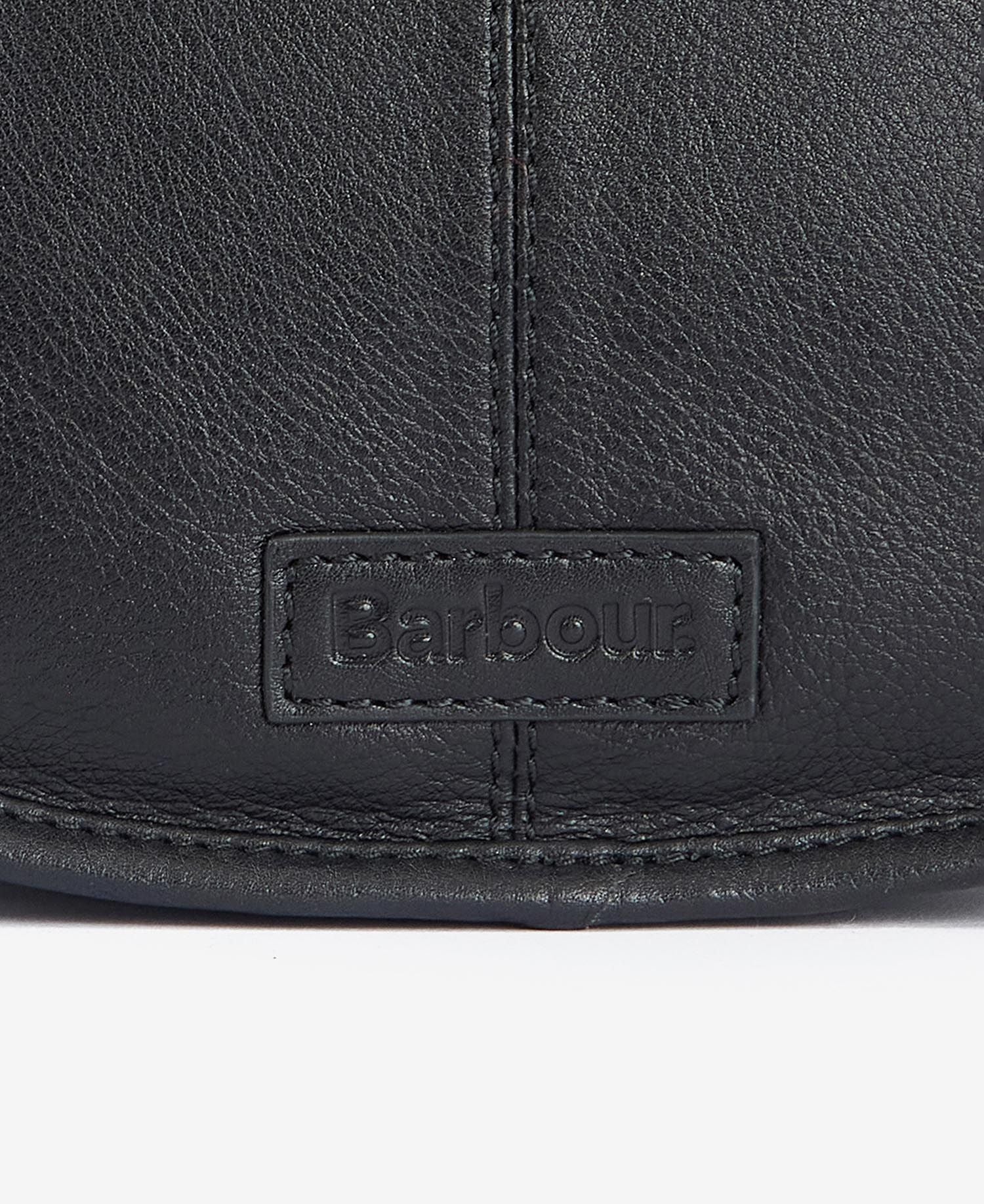 Women wearing Barbour Laire Medium Leather Saddle Bag showing Barbour logo