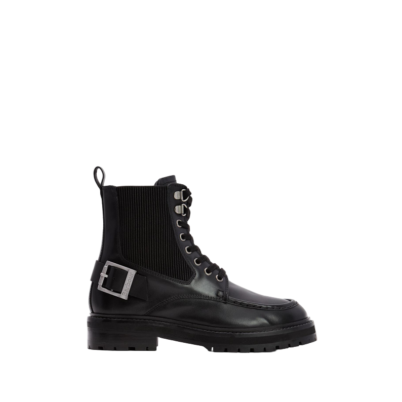 Black boot with a buckle on a white background