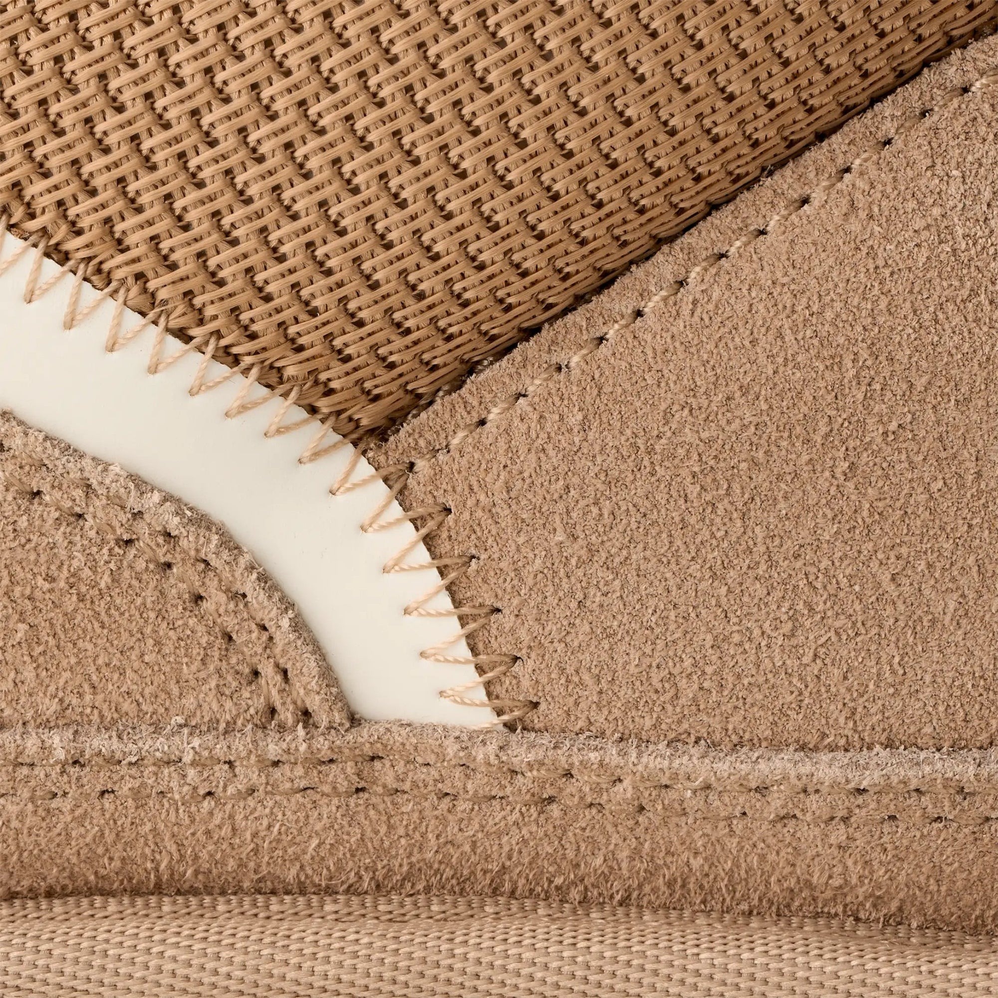 Close-up of UGG Lowmel in Sand fabric with white stitching detail