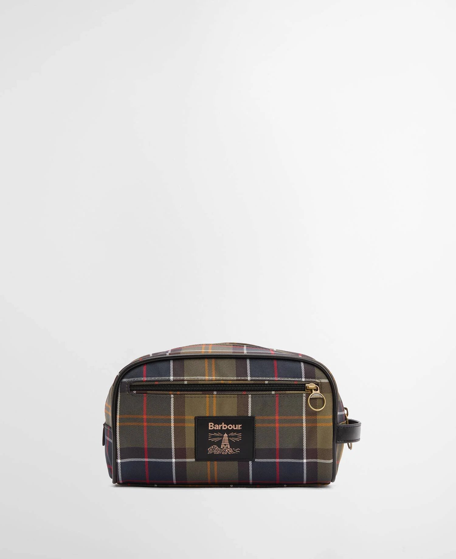 A Barbour toiletry bag in a classic tartan plaid pattern featuring navy, green, red, and yellow stripes, with a black leather brand patch on the front.