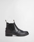 A black Barbour leather Chelsea-style ankle boot with elastic side gore, a black sole, and bright red pull loops at the top, shown in a side profile on a light gray background.