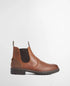 A brown Barbour leather Chelsea boot with dark brown elastic side panels and a dark sole, shown in profile against a light gray background.