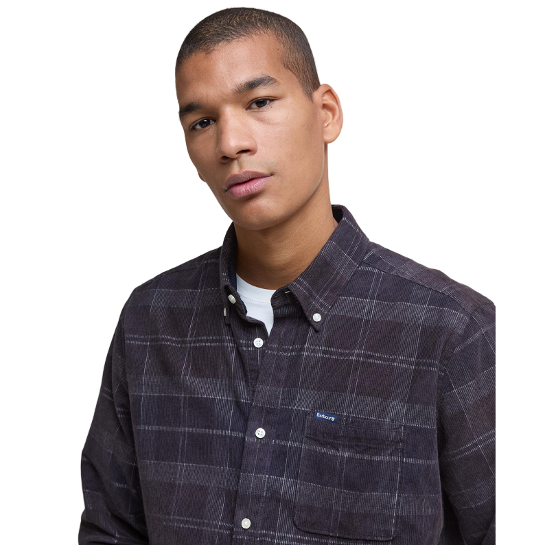 Man wearing a Barbour plaid shirt close up 