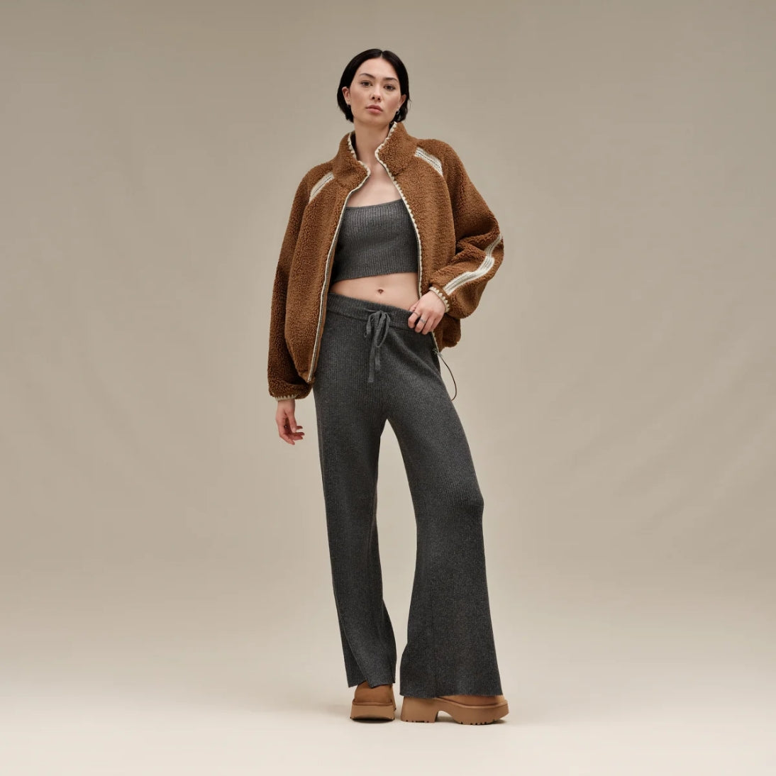 A chestnut brown UGG Classic Ultra Mini New Heights Boot with a suede upper and a chunky platform heel.