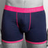 Navy boxer briefs with pink waistband and trim on a gray background