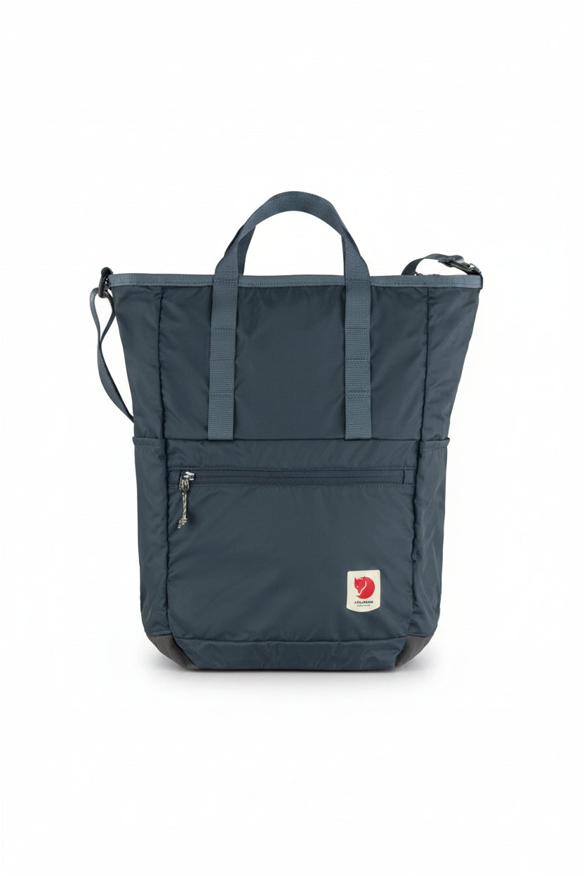 Blue tote bag with a visible brand logo on a white background