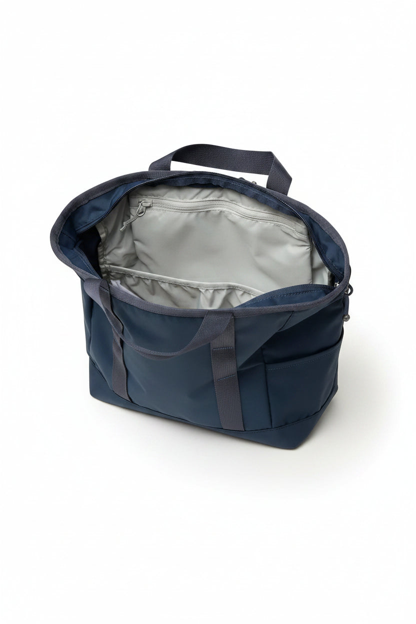Open blue backpack showing interior with beige item