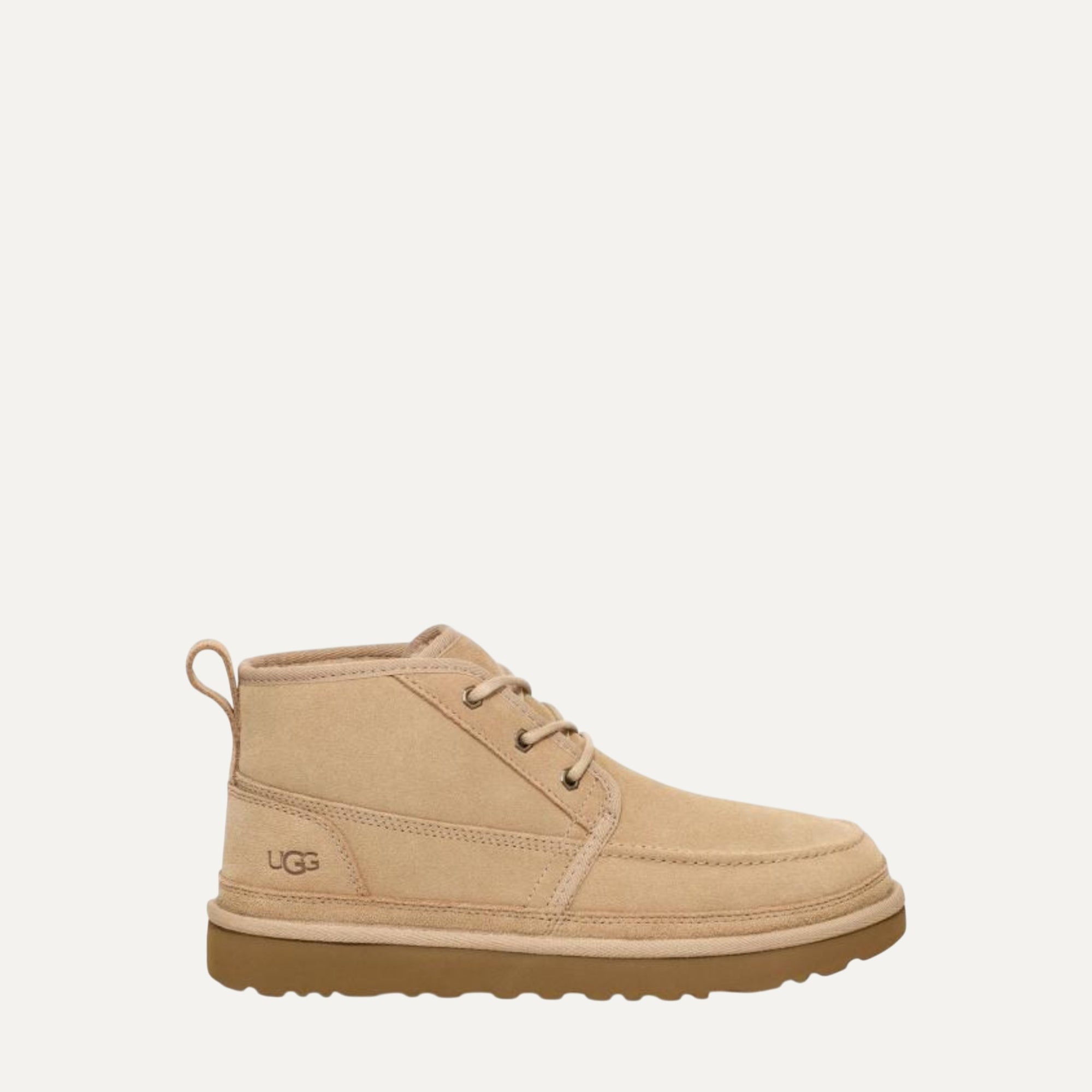 Beige UGG boot on a white background