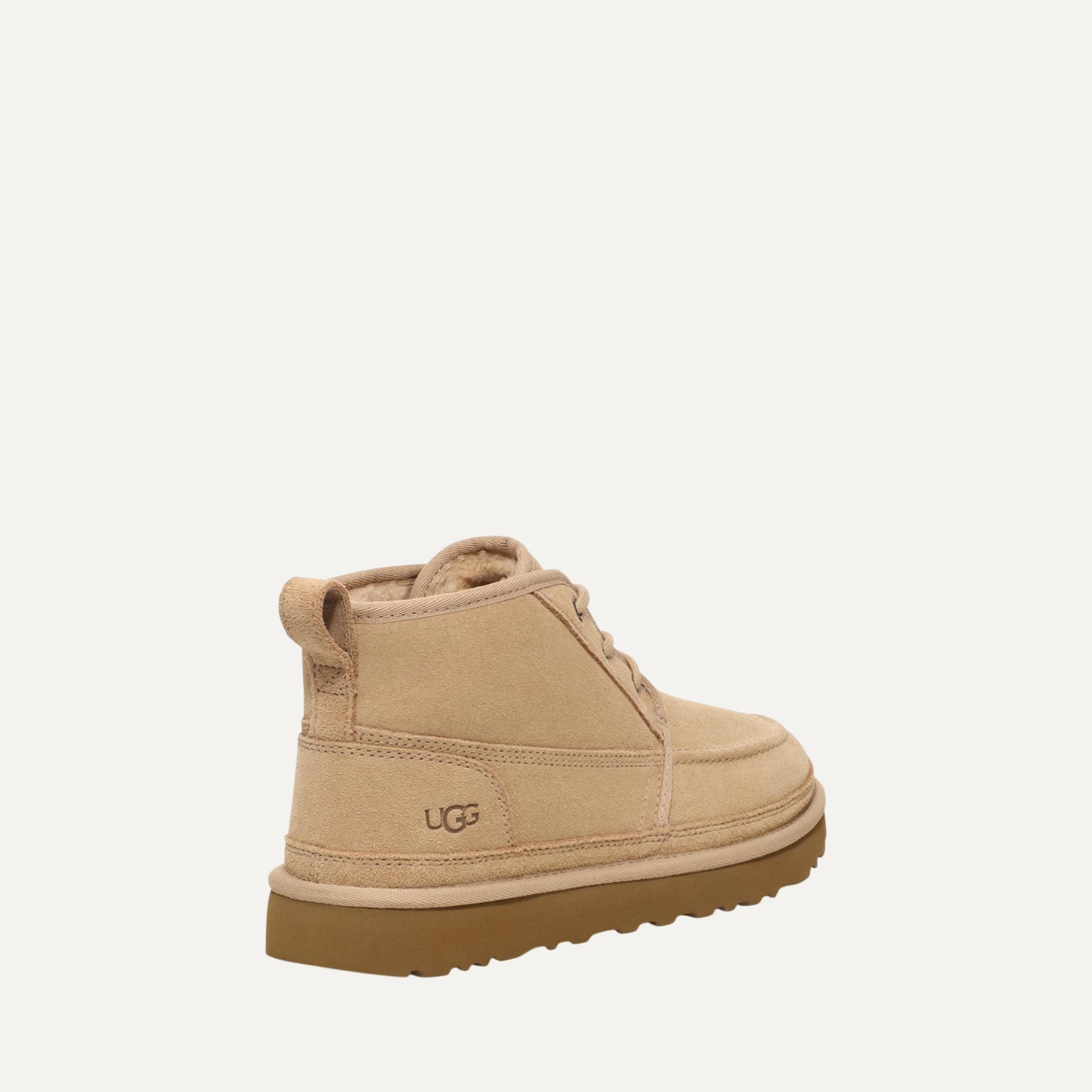 Beige UGG boot on a white background