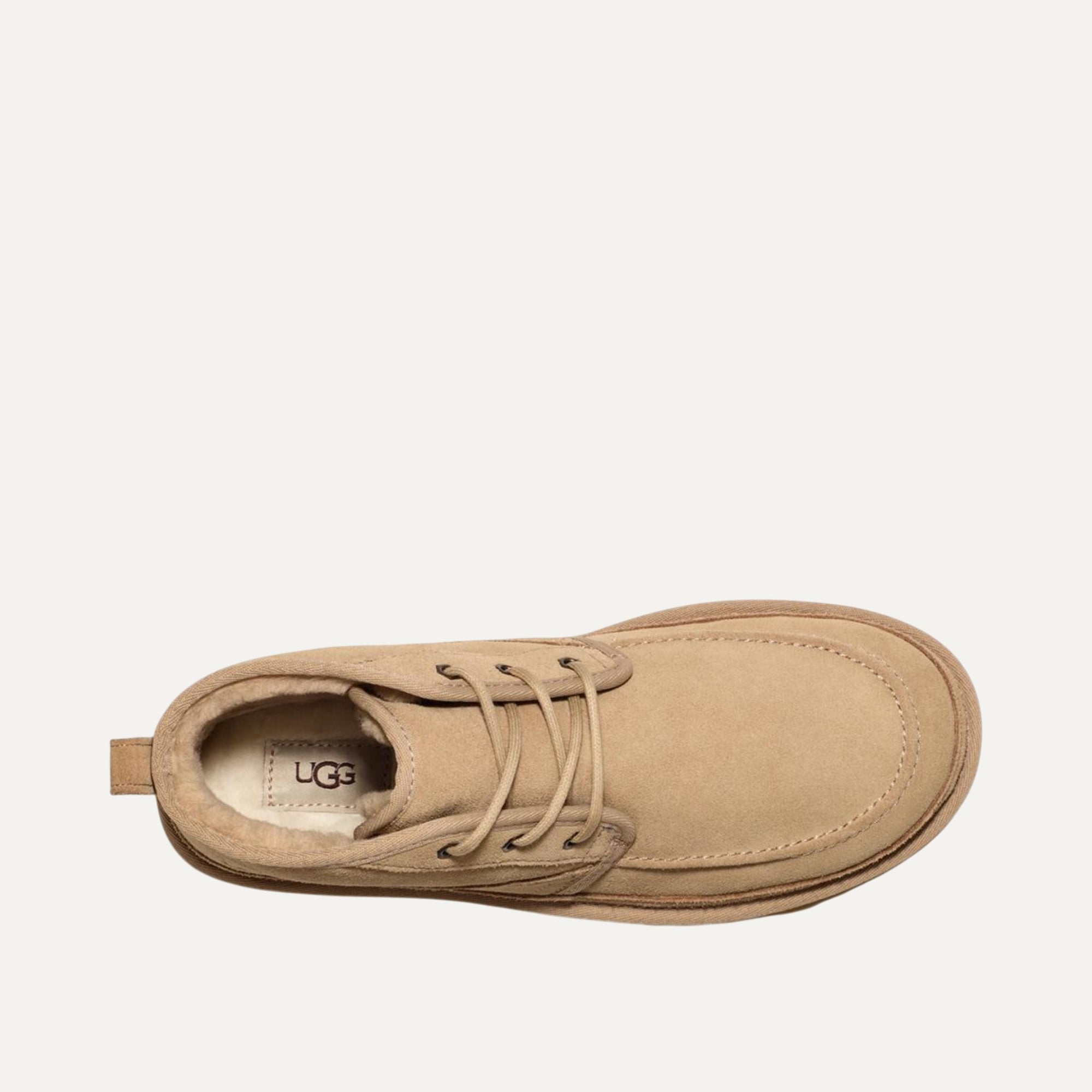 Tan UGG shoe on a white background