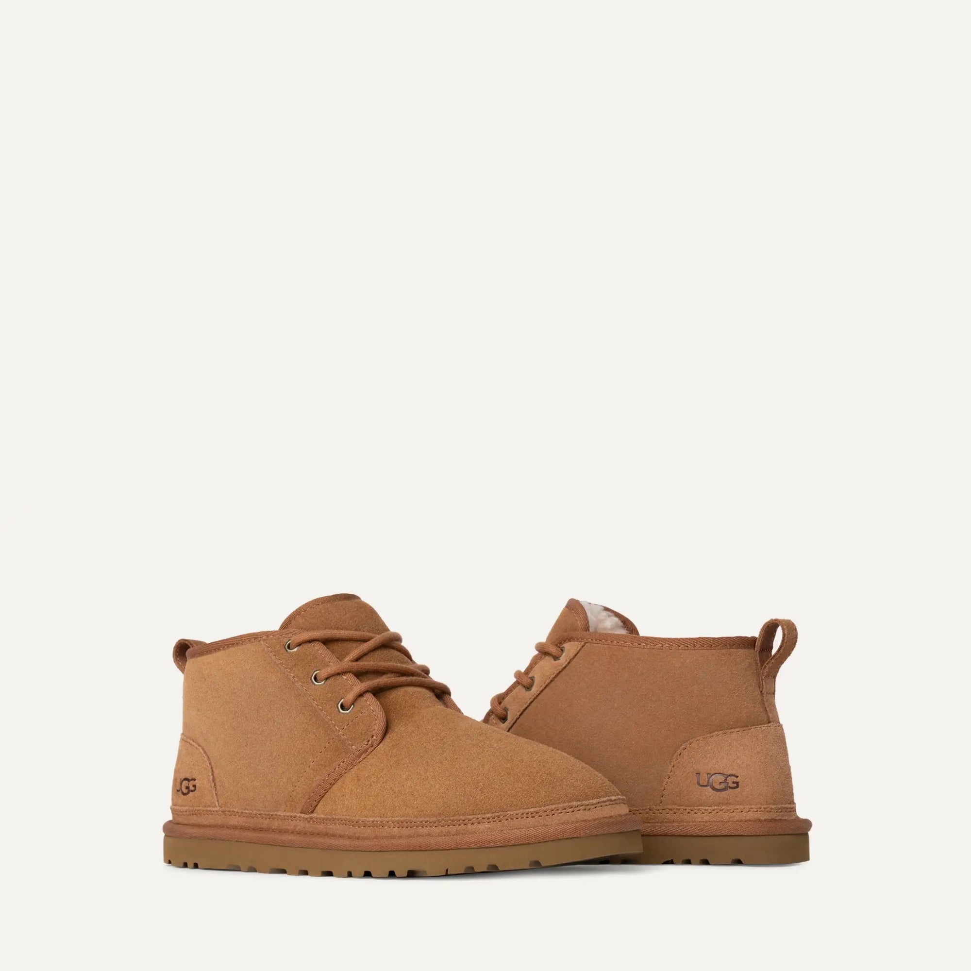 Pair of brown UGG boots on a white background