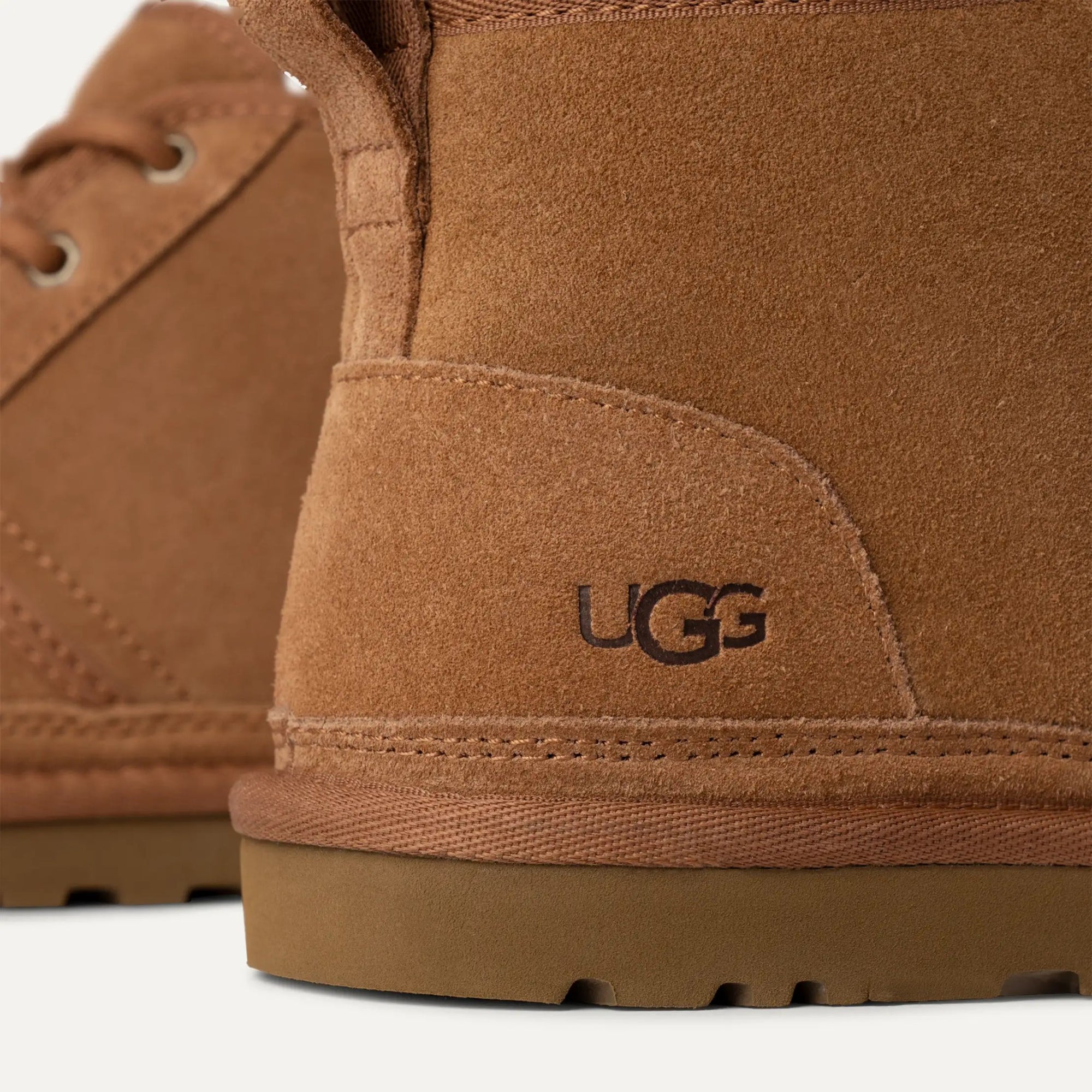 Close-up of brown UGG boots with visible brand logo.