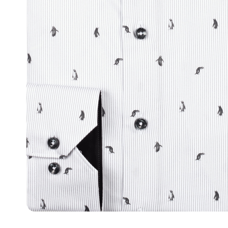 White shirt with black penguin pattern and button details cuffs
