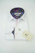 White dress shirt with colorful inner lining on a wooden surface