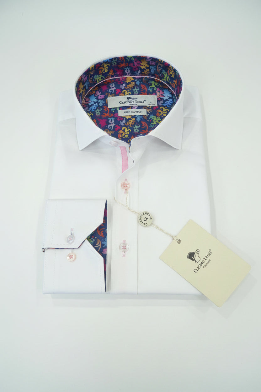 White dress shirt with colorful inner lining on a wooden surface