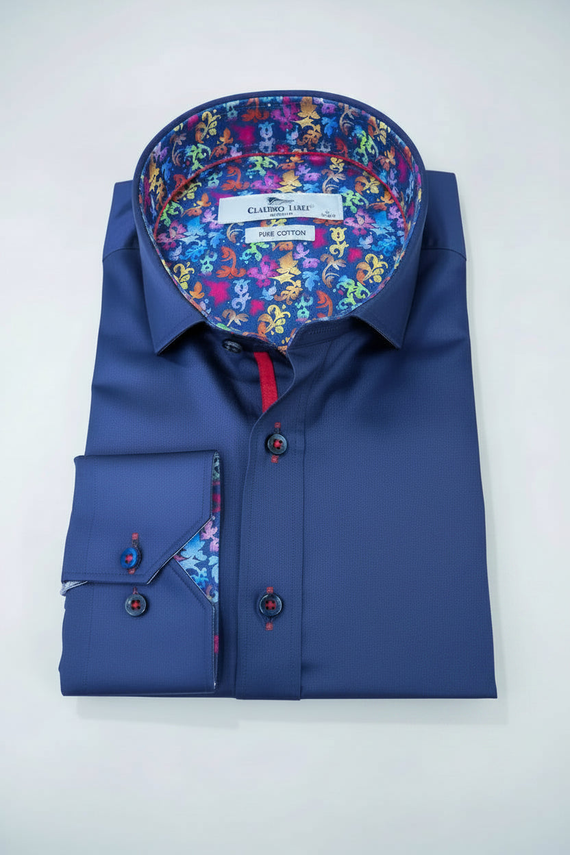 Blue dress shirt with floral pocket square and colorful lining on a wooden surface