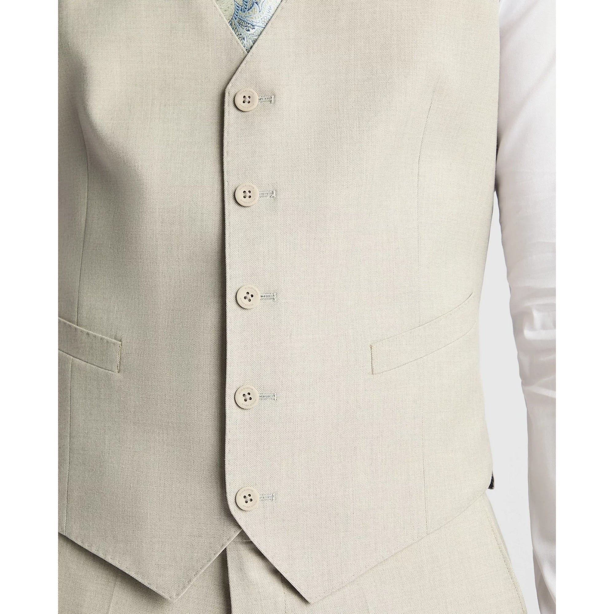 Beige vest with buttons on a white background