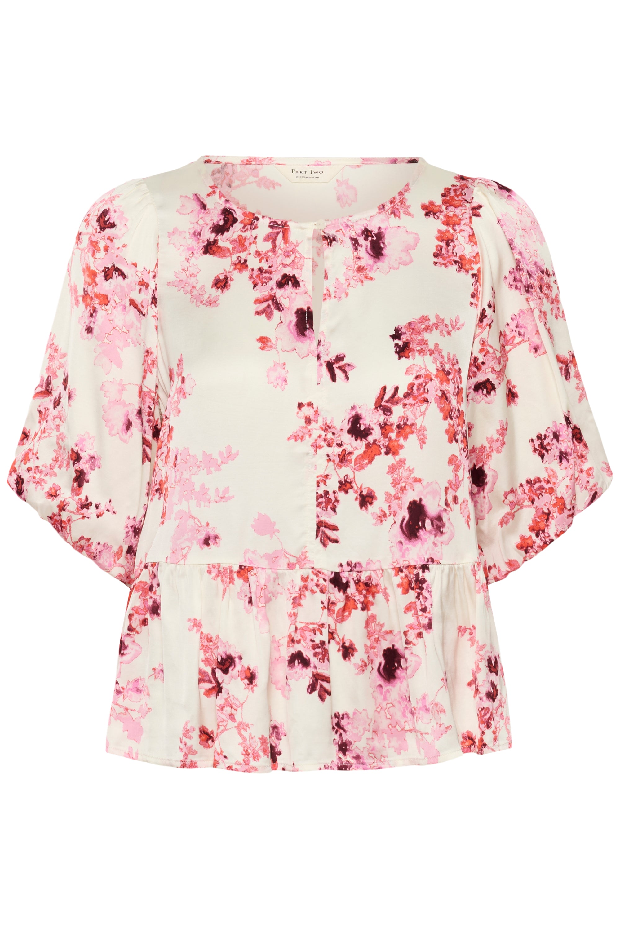 Floral blouse with pink and red patterns on a white background