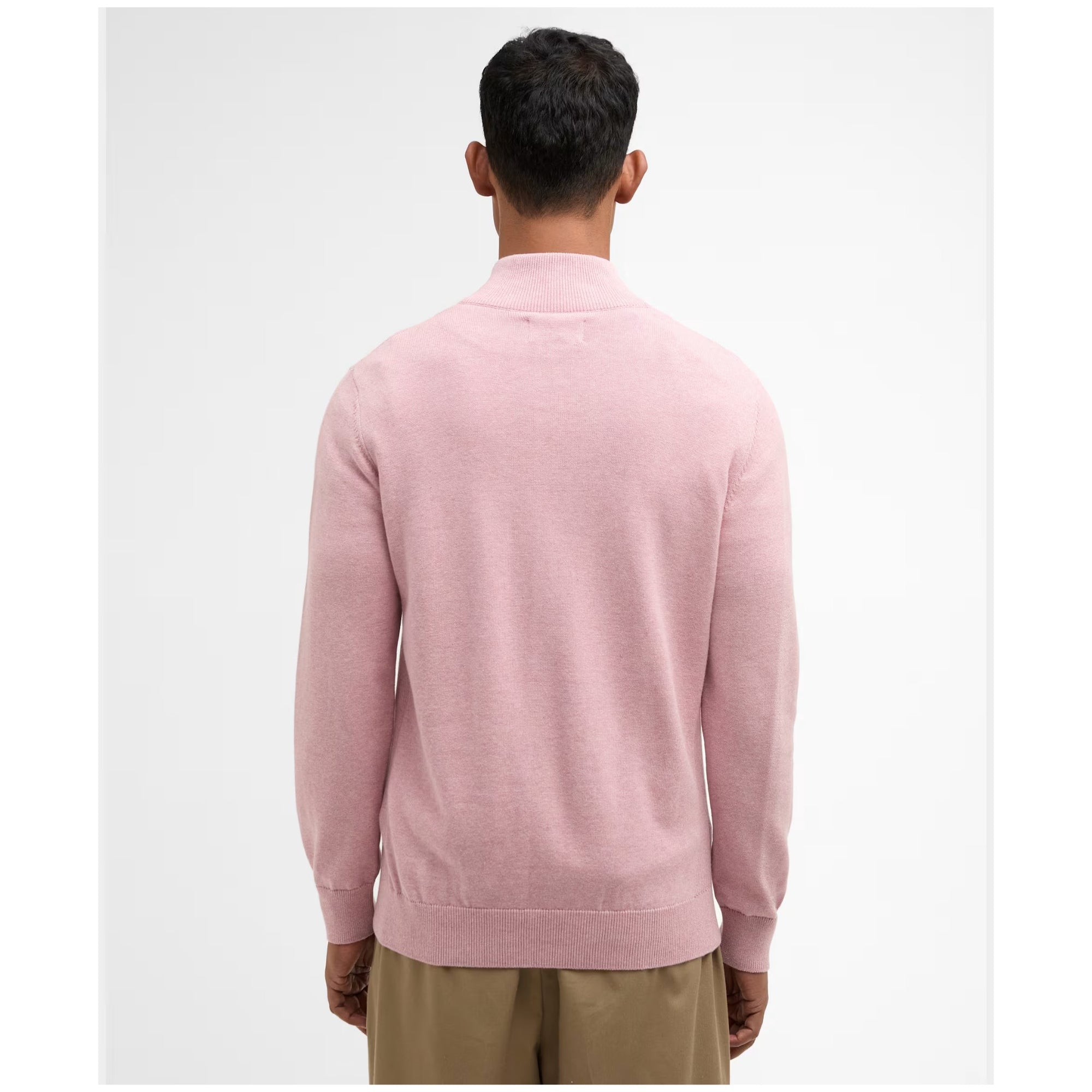 Person wearing a pink sweater from behind on a white background