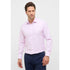 Man wearing a light pink dress shirt and navy pants on a white background