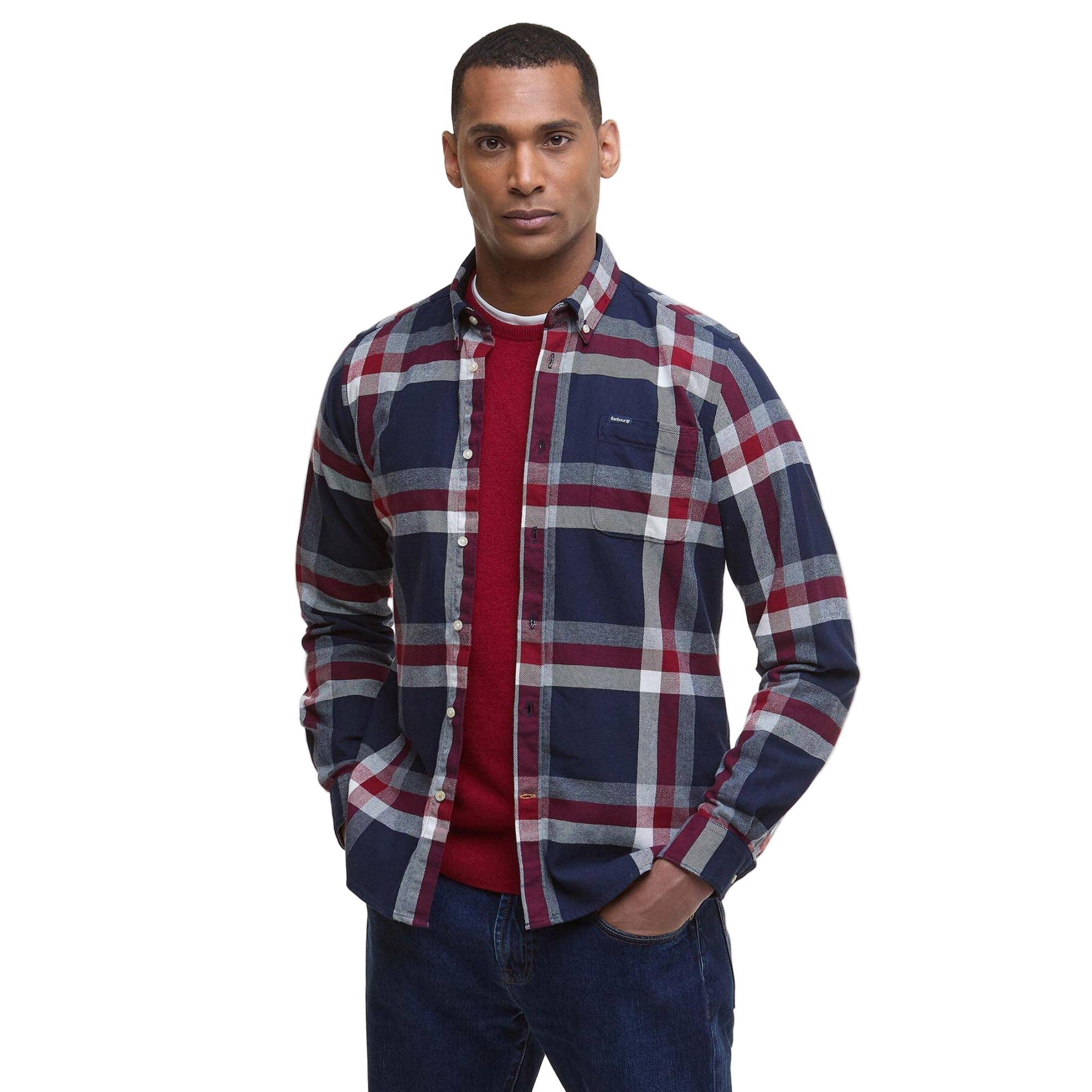 Man wearing a plaid shirt with a visible brand logo on a white background