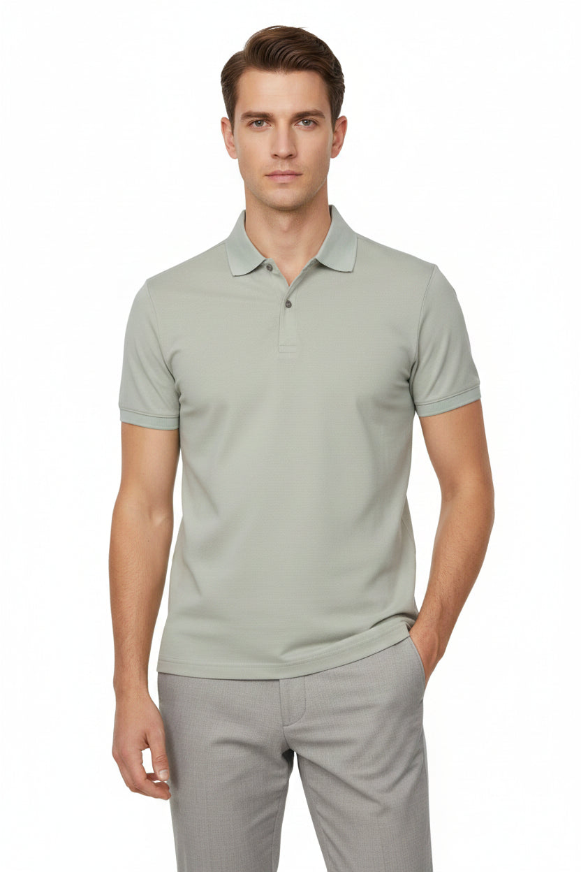 Sage green polo shirt against a white background