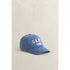 Blue cap with 'GANT' branding on a beige background