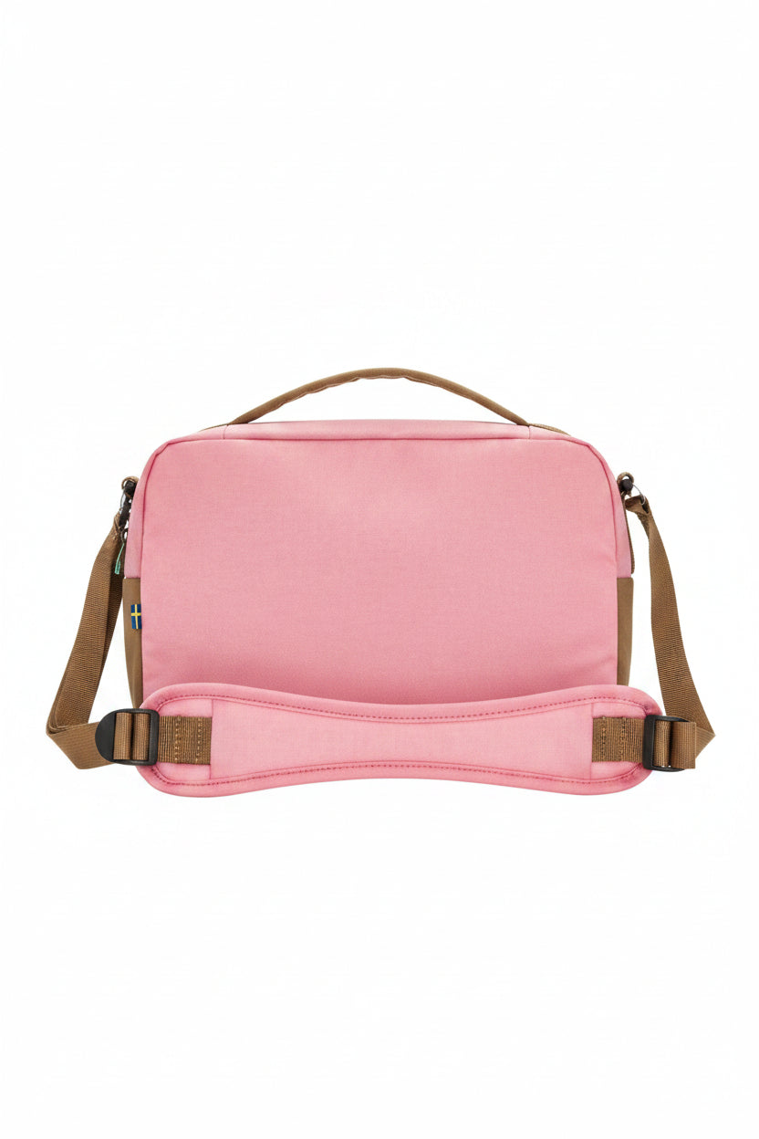 Pink bag with brown straps on a white background