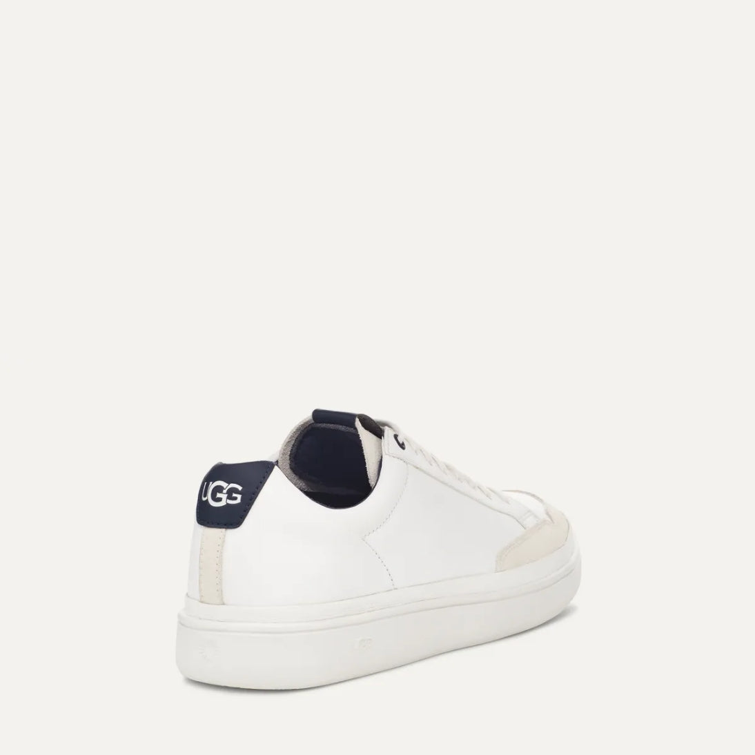 A white UGG South Bay Low Trainer sneaker with lace-up closure and a rubber outsole.