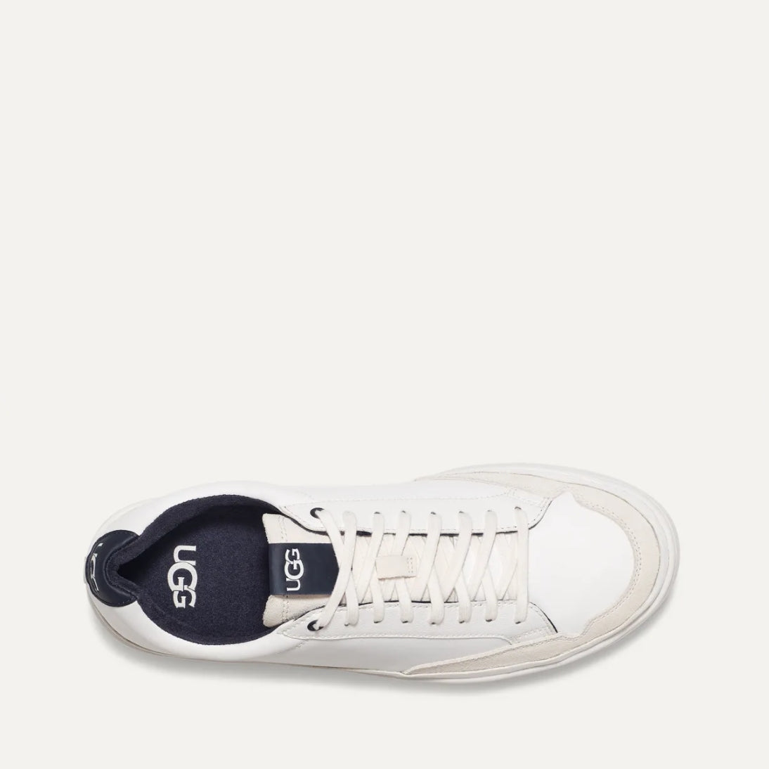 A white UGG South Bay Low Trainer sneaker with lace-up closure and a rubber outsole.